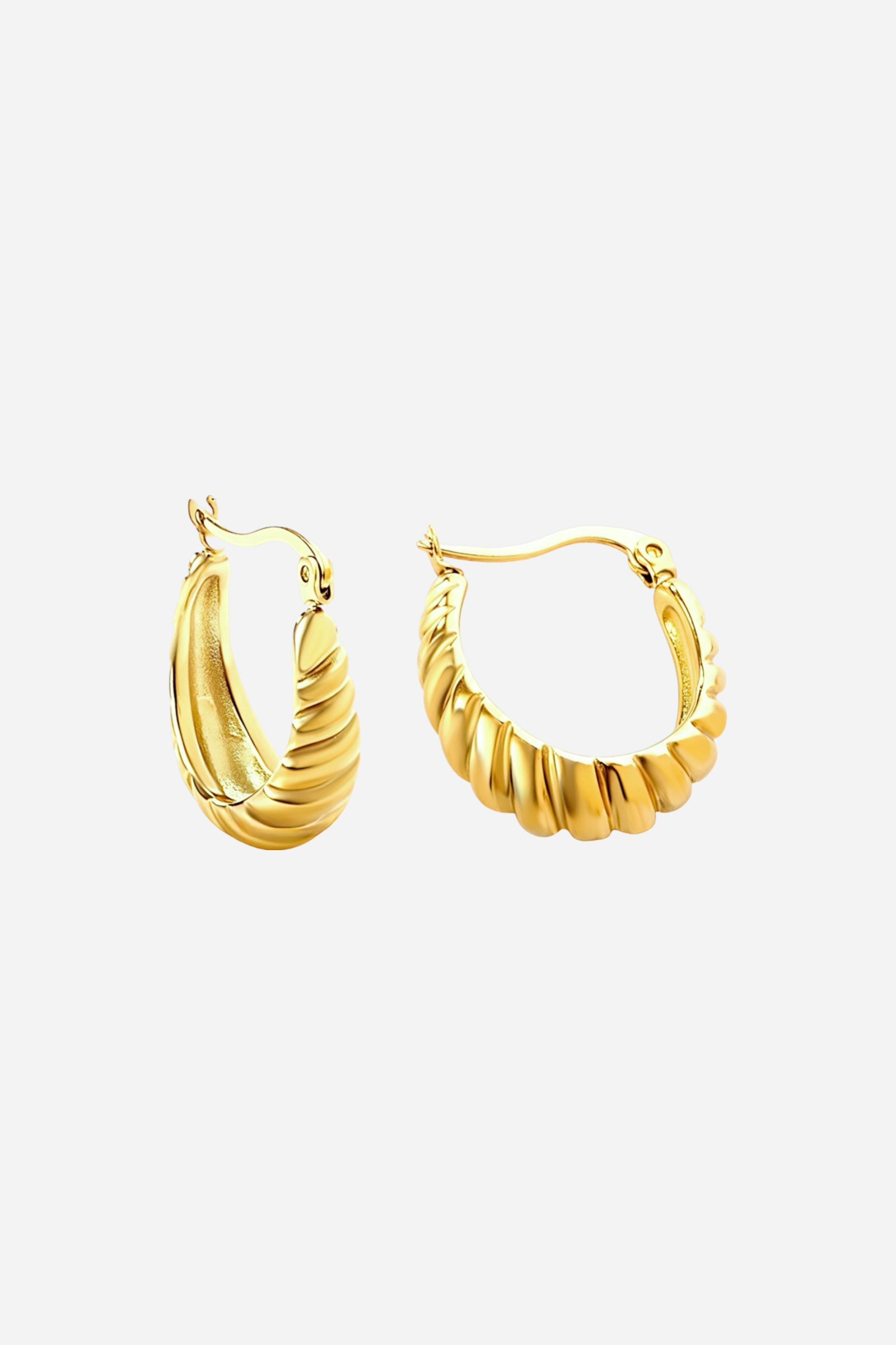 Ribbed gold hoop earrings crafted from PVD 18K gold plated stainless steel, shown from side angle highlighting the sculpted ridges and lustrous shine — GLISTIA