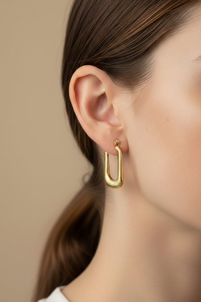 Side view of ribbed rectangle hoop earrings crafted from 18K PVD gold plated stainless steel, lightweight water safe gold hoops GLISTIA