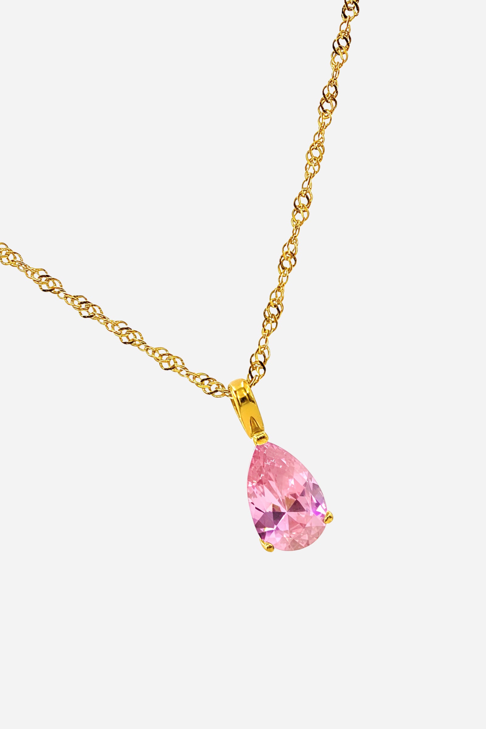 Side angle showing the rose pink zircon pendant and polished PVD 18K gold plated chain from the October Birthstone Necklace.