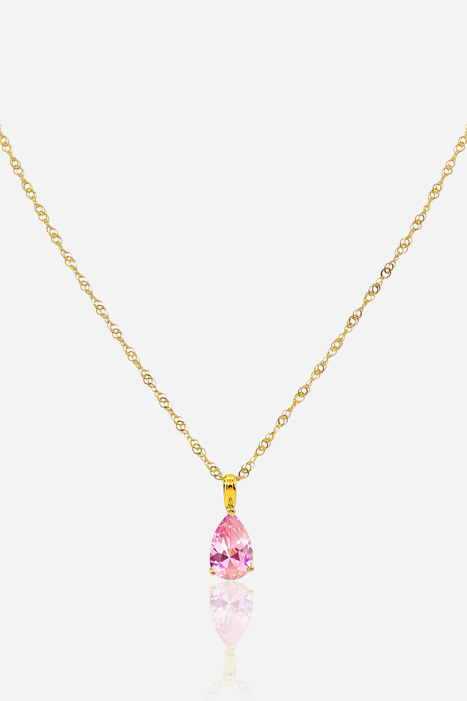 Zoom of the rose pink zircon pendant on the October Birthstone Necklace with gold plated stainless steel setting.