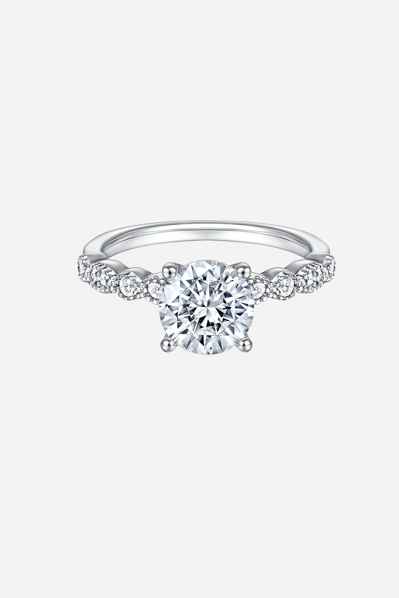 Top-view of GLISTIA sterling silver twist band ring featuring a brilliant round-cut zircon and pavé side accents.