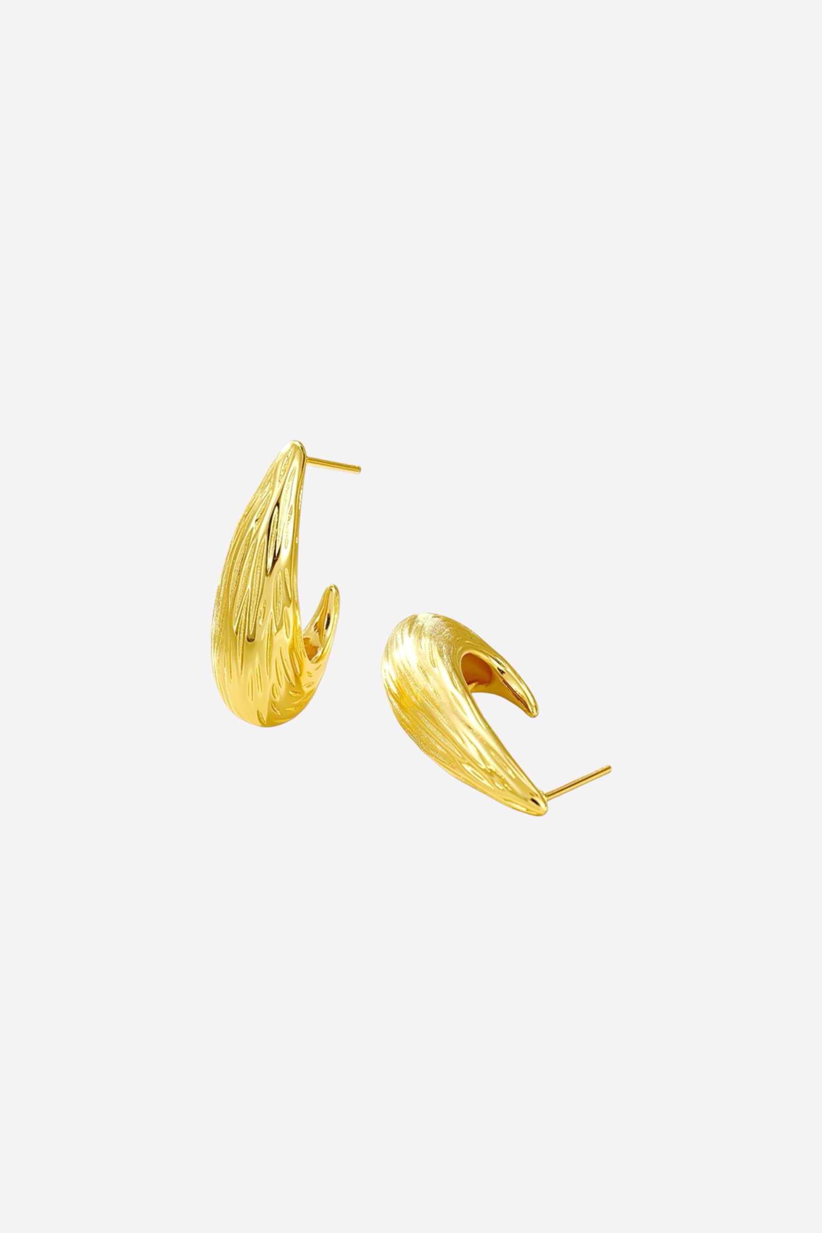 Angled view of sculpted teardrop earrings crafted in 18K gold plated stainless steel with elegant textured detailing – GLISTIA jewellery