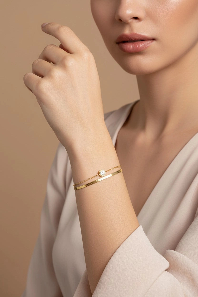 Serena dual chain crystal bracelet in 18K PVD gold plated stainless steel with elegant layered sparkle detail