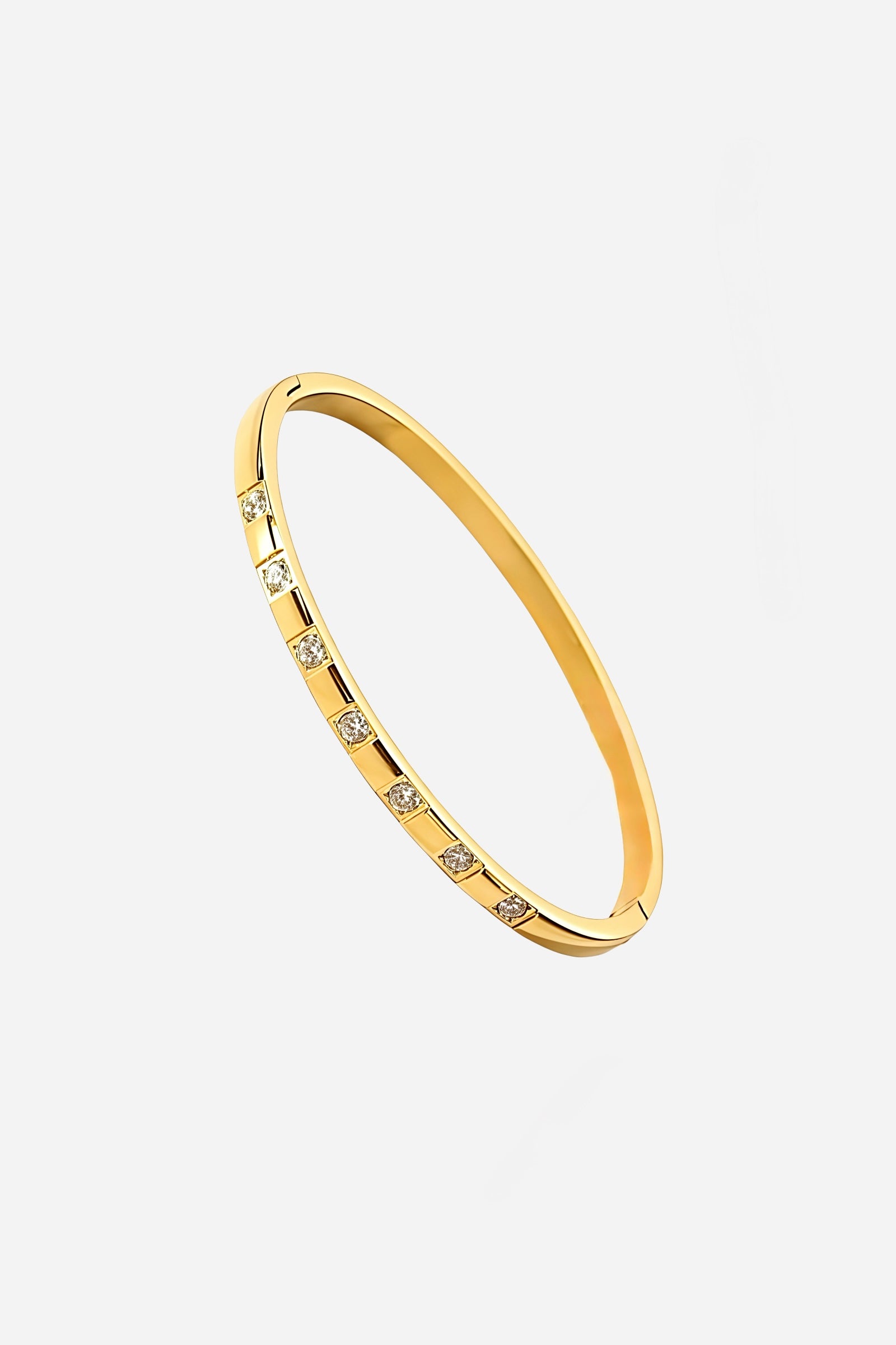 Top angle of Spaced Crystal Bangle in 18K gold-plated stainless steel, displaying its sleek circular design and uniformly set cubic zirconia stones.