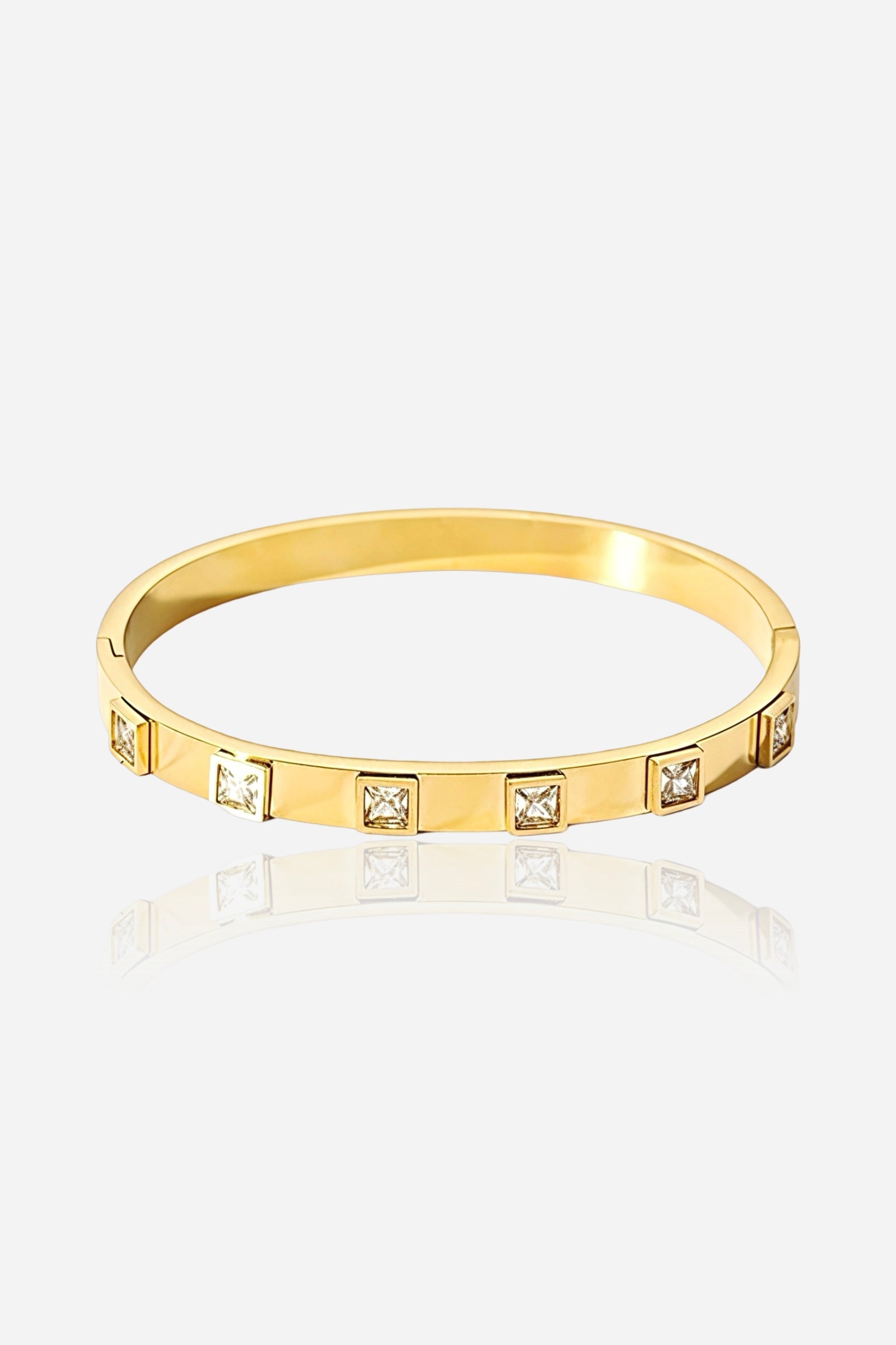 Front view of the Square-Cut Crystal Bangle crafted from stainless steel with 18K PVD gold plating, featuring evenly spaced cubic-zirconia crystals - GLISTIA.