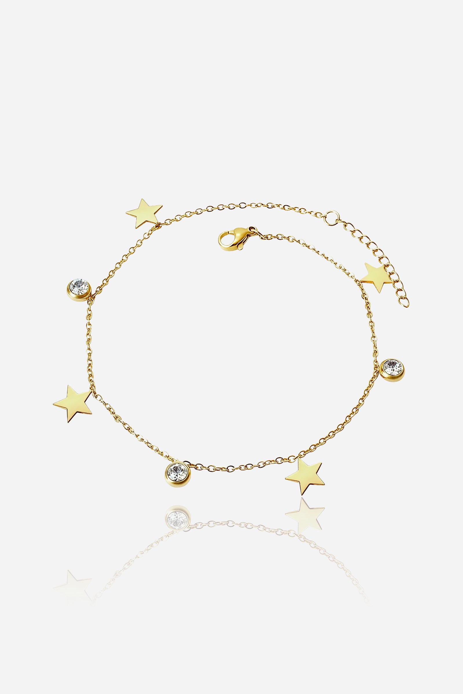 Top view of the gold Star Charm Anklet with alternating star pendants and bezel-set crystal accents – GLISTIA.