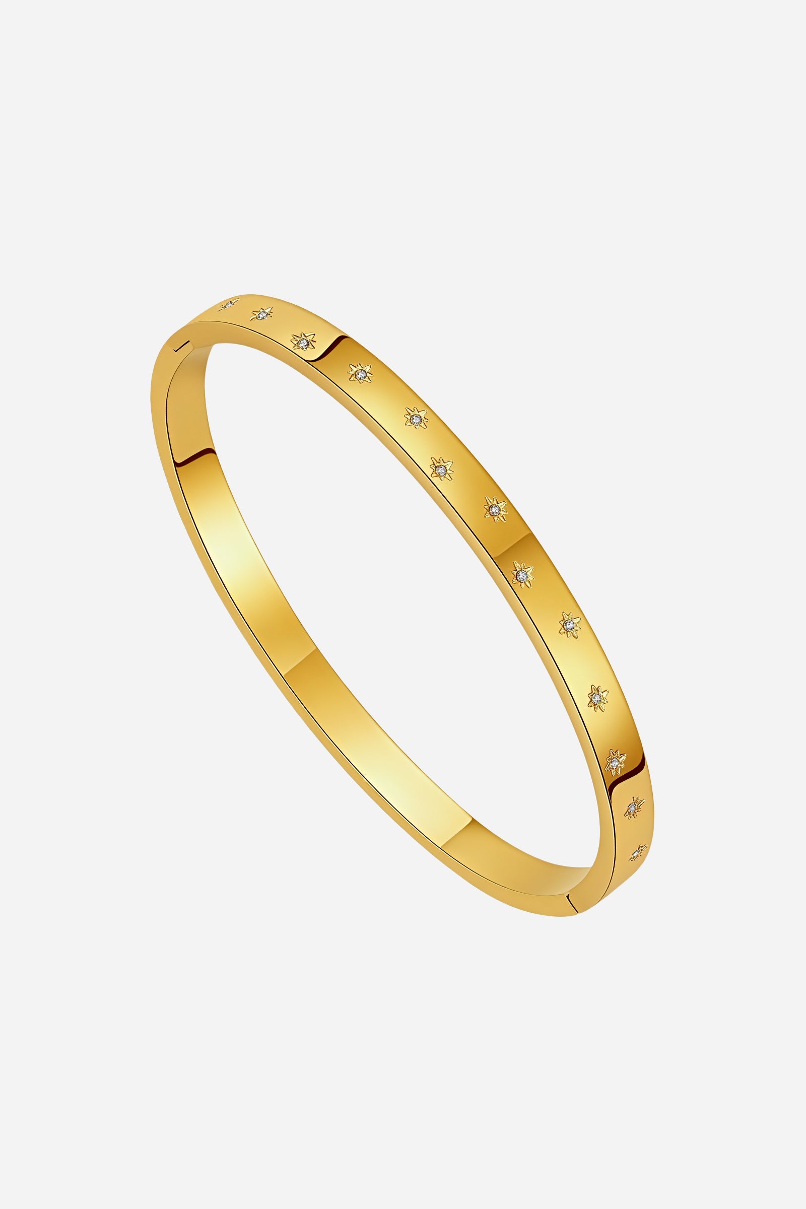 Side angle of 18K gold-plated GLISTIA Star Crystal Bangle showing smooth polished finish and delicate star-engraved crystal inlays.