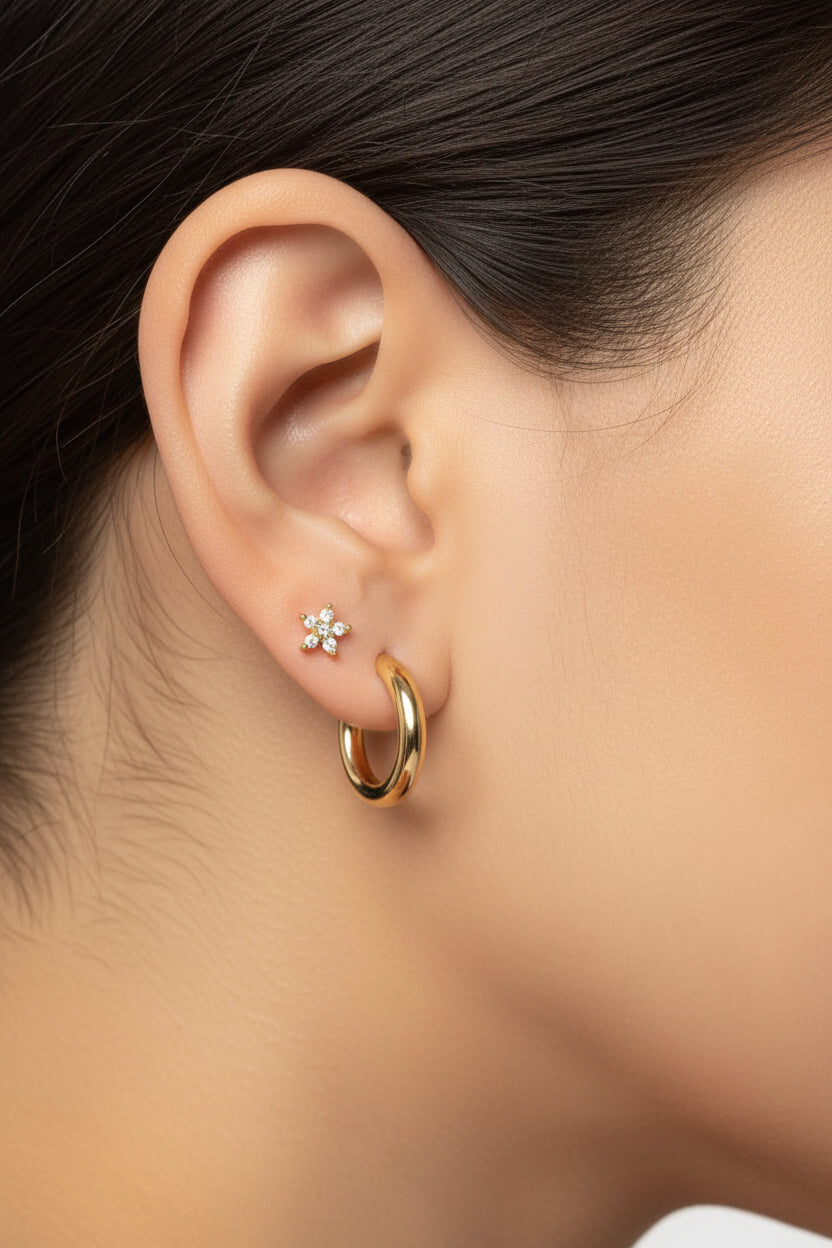 Close-up of star crystal flat-back piercing earring highlighting cubic zirconia stones and polished 18K PVD gold plated finish