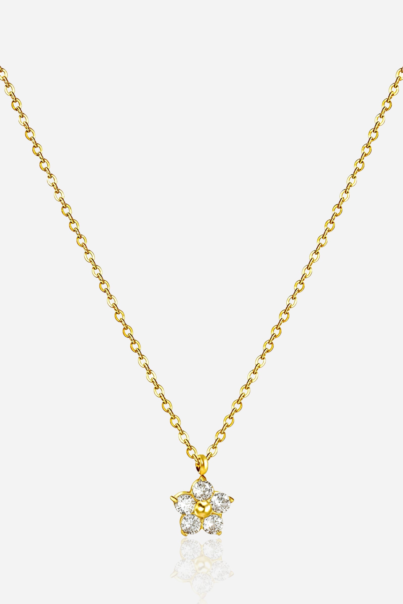 Zoom-angle view of GLISTIA Stella Star Pendant highlighting the raised crystal setting and polished gold finish.