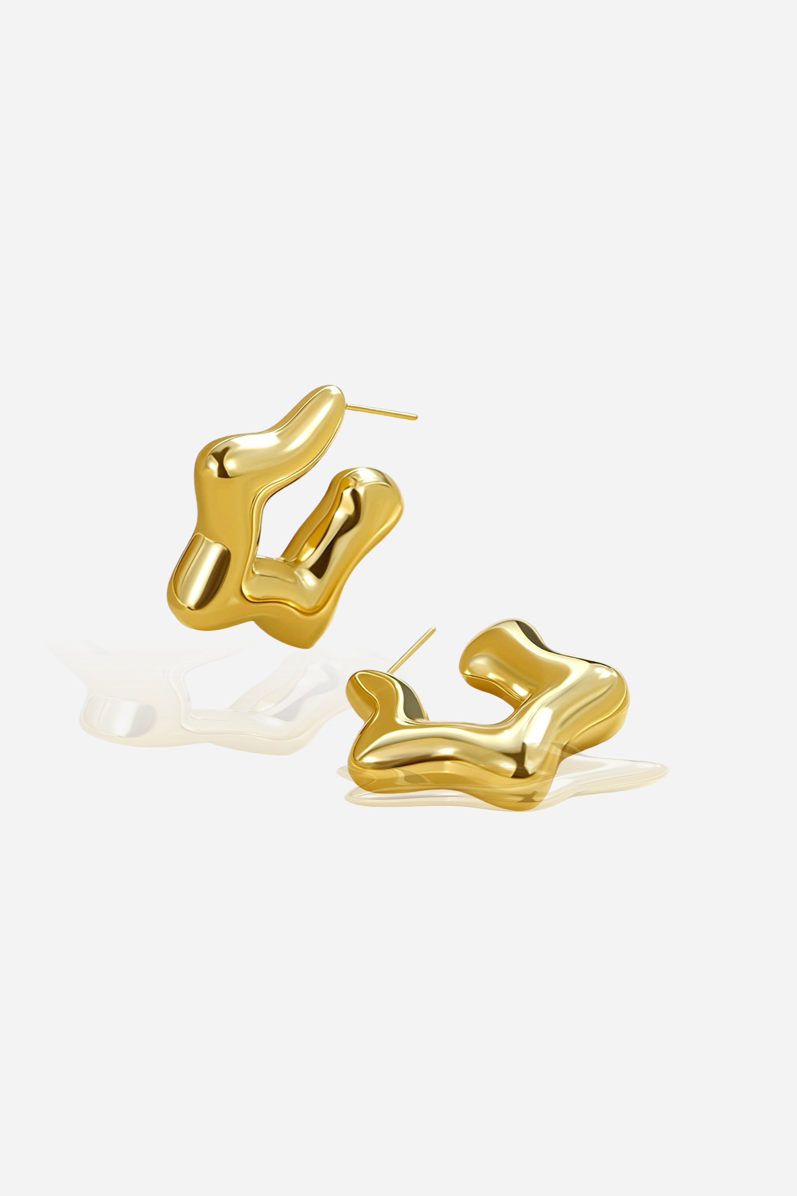 Artistic view of Stellar Gold Hoop Earrings crafted from stainless steel with a smooth sculptural shape and PVD 18K gold plated finish – GLISTIA.