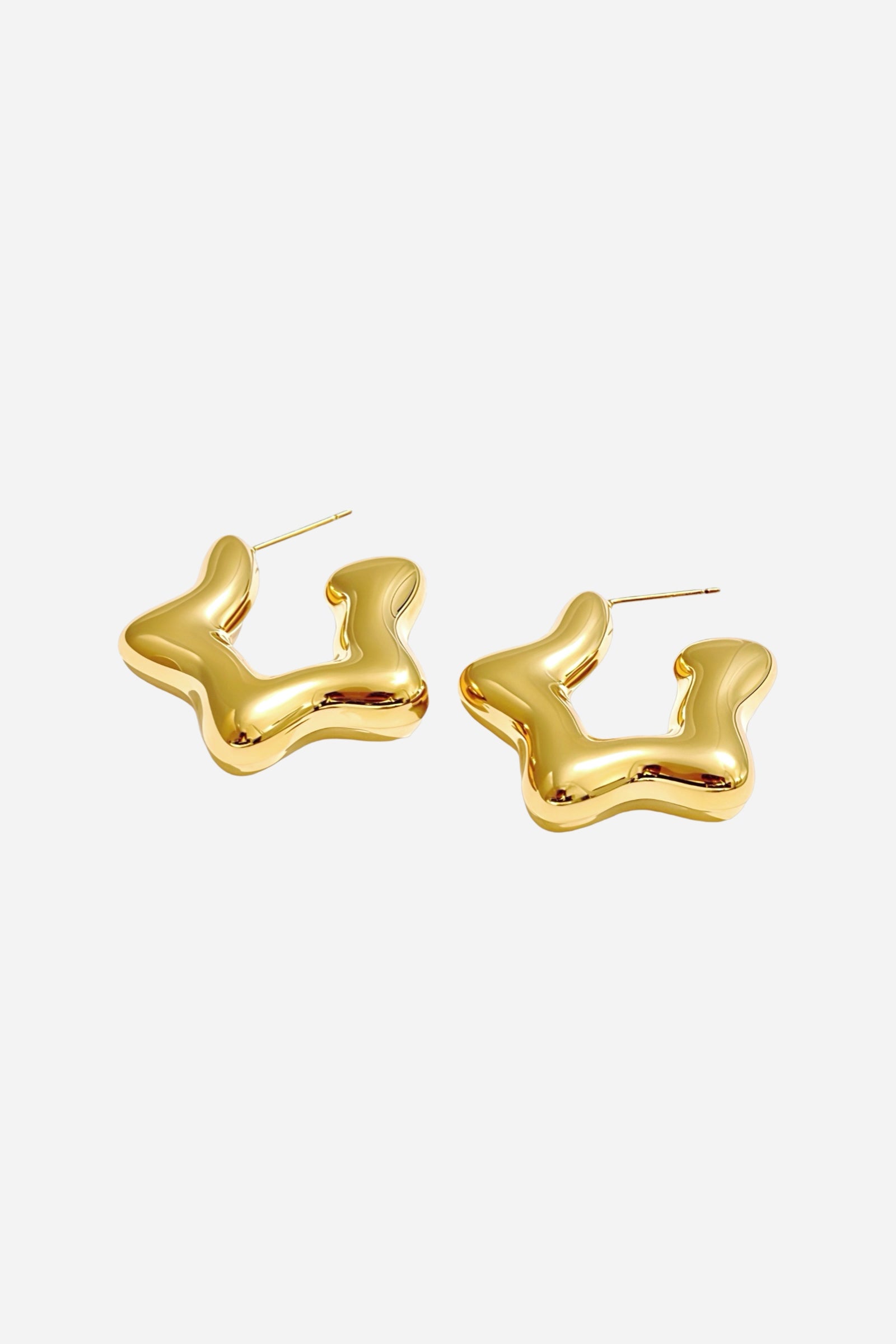 Side view of Stellar Gold Hoop Earrings in a bold abstract shape, crafted from stainless steel and finished with PVD 18K gold plating – GLISTIA.