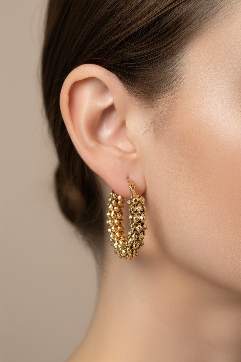 Close-up detail of textured bubble hoop earrings in 18K PVD gold plated stainless steel showing clustered bubble texture