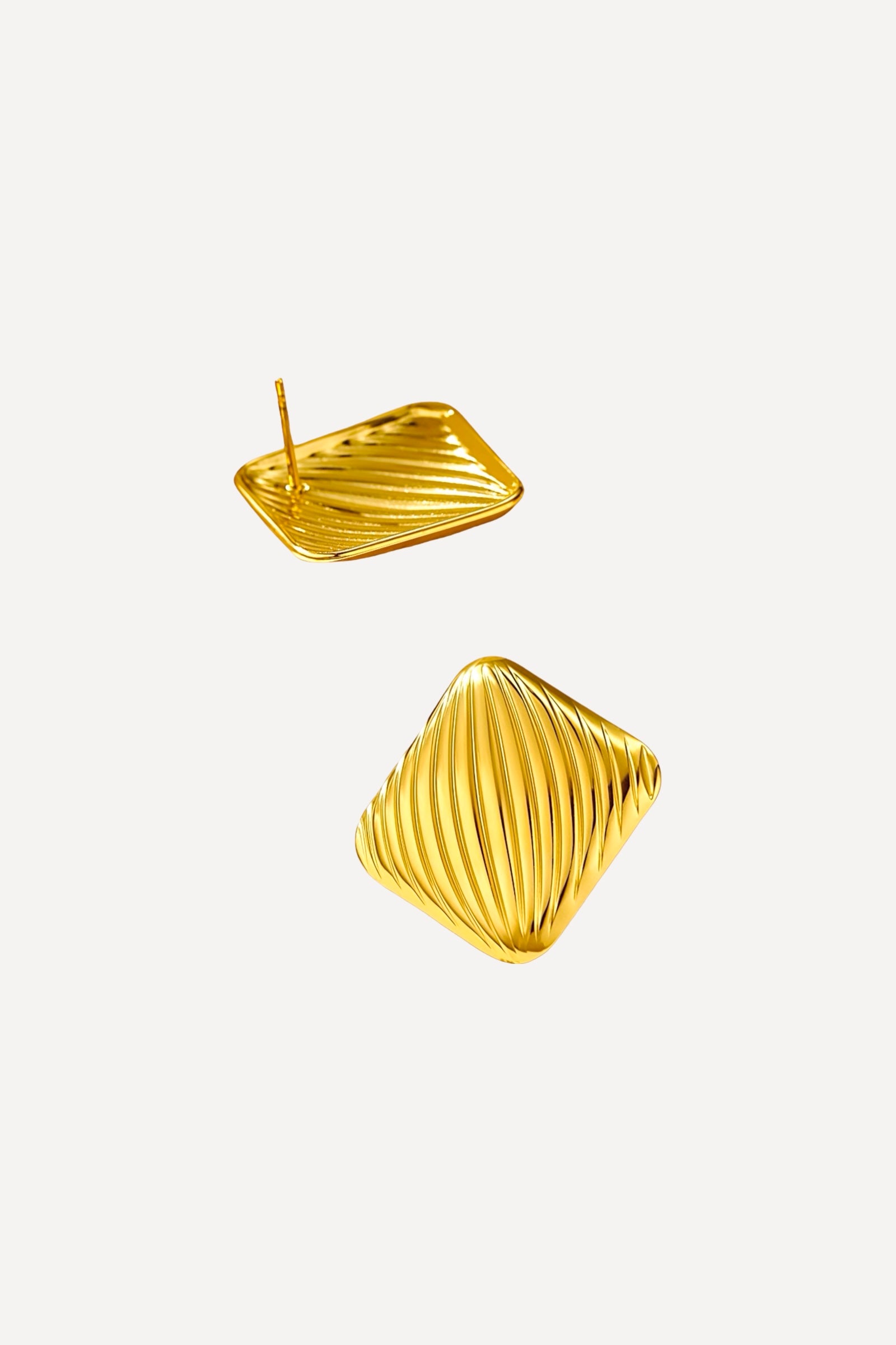 Back and angled view of textured square stud earrings crafted from stainless steel with a radiant PVD 18K gold plated finish, showing fine diagonal ridges and secure post-back closure – GLISTIA.
