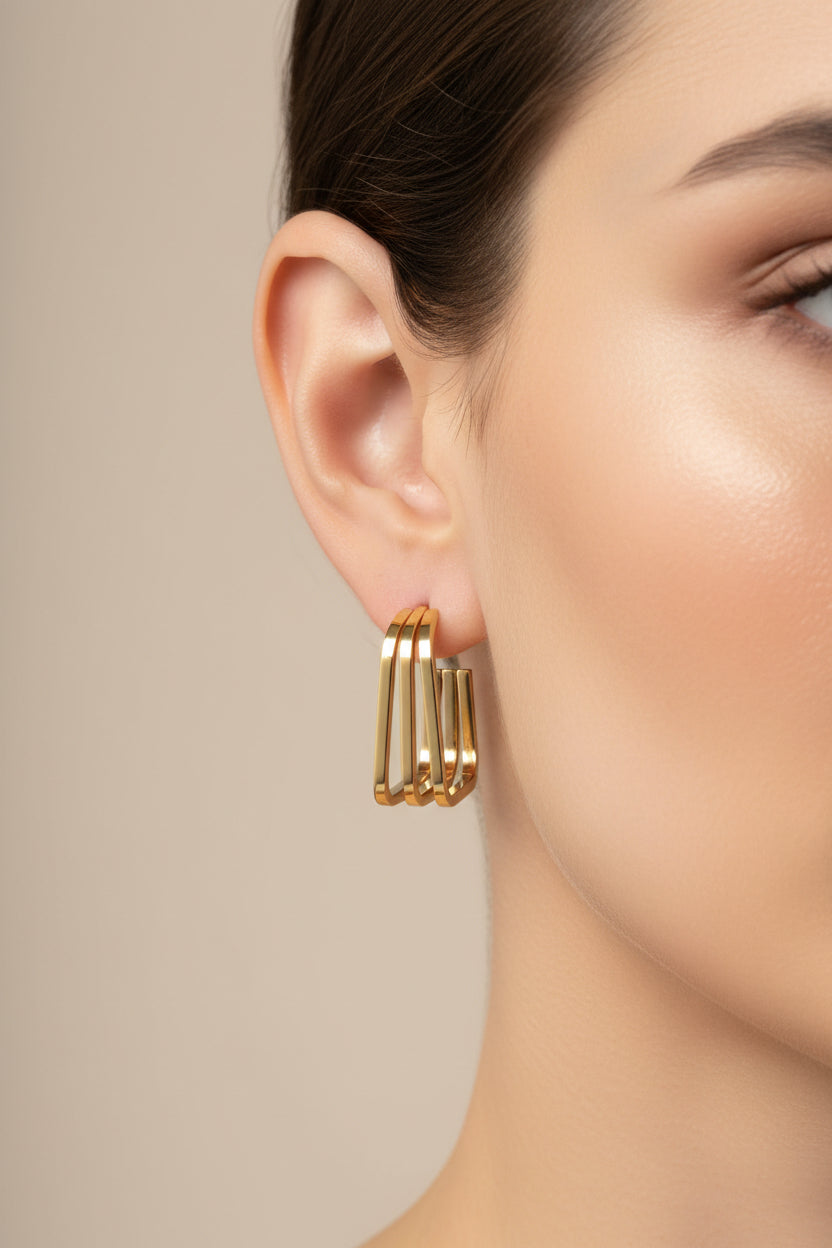 Side view of triple-layer square gold hoop earrings in 18K PVD gold plated stainless steel, lightweight modern hoops
