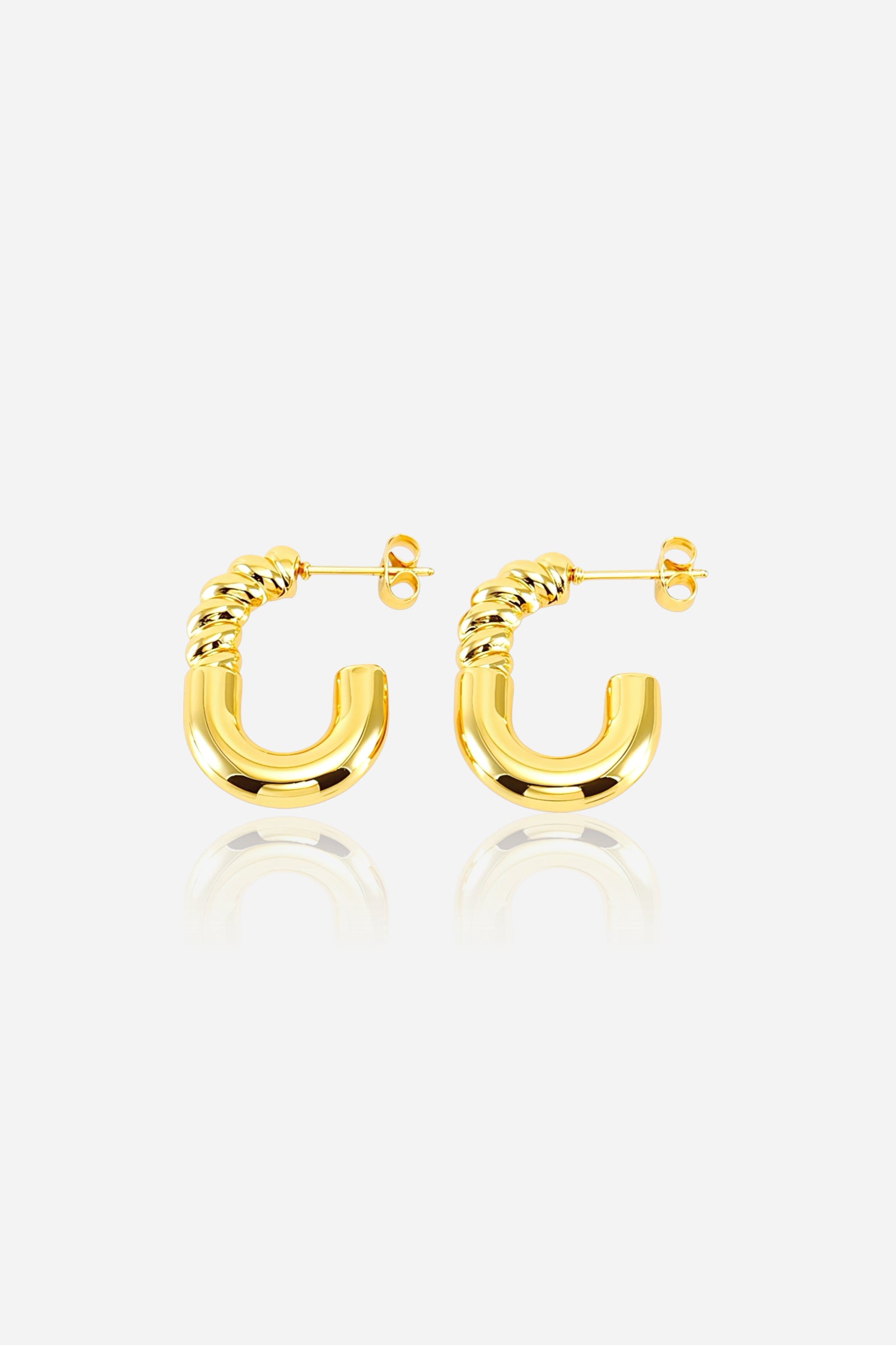 Top view of twist curve half hoop earrings in 18K PVD gold plated stainless steel with polished and twisted detailing – GLISTIA jewellery