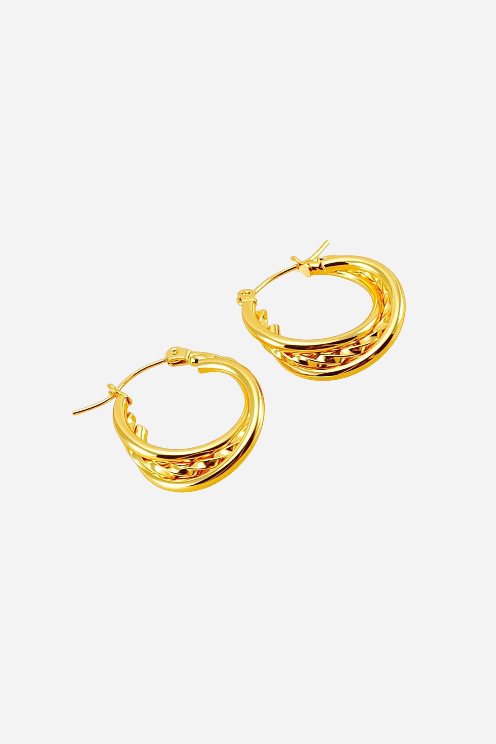 Twist double-hoop earrings crafted in stainless steel with a polished 18K gold plated finish, featuring interwoven curved bands for a modern and elegant look – GLISTIA