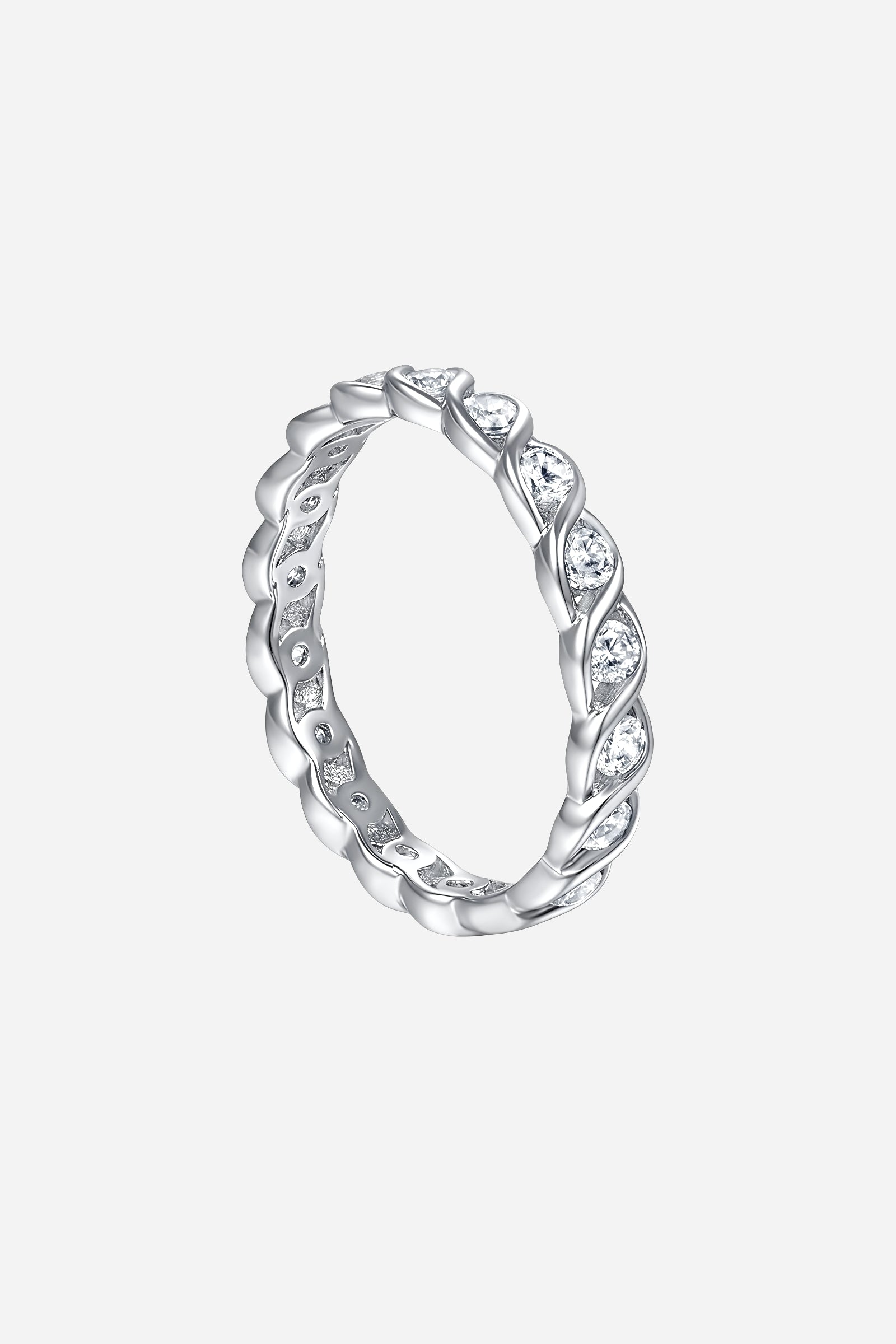 Side-angle image of GLISTIA Twist Eternity Band Ring showcasing the polished twisted pattern and full eternity stone layout.