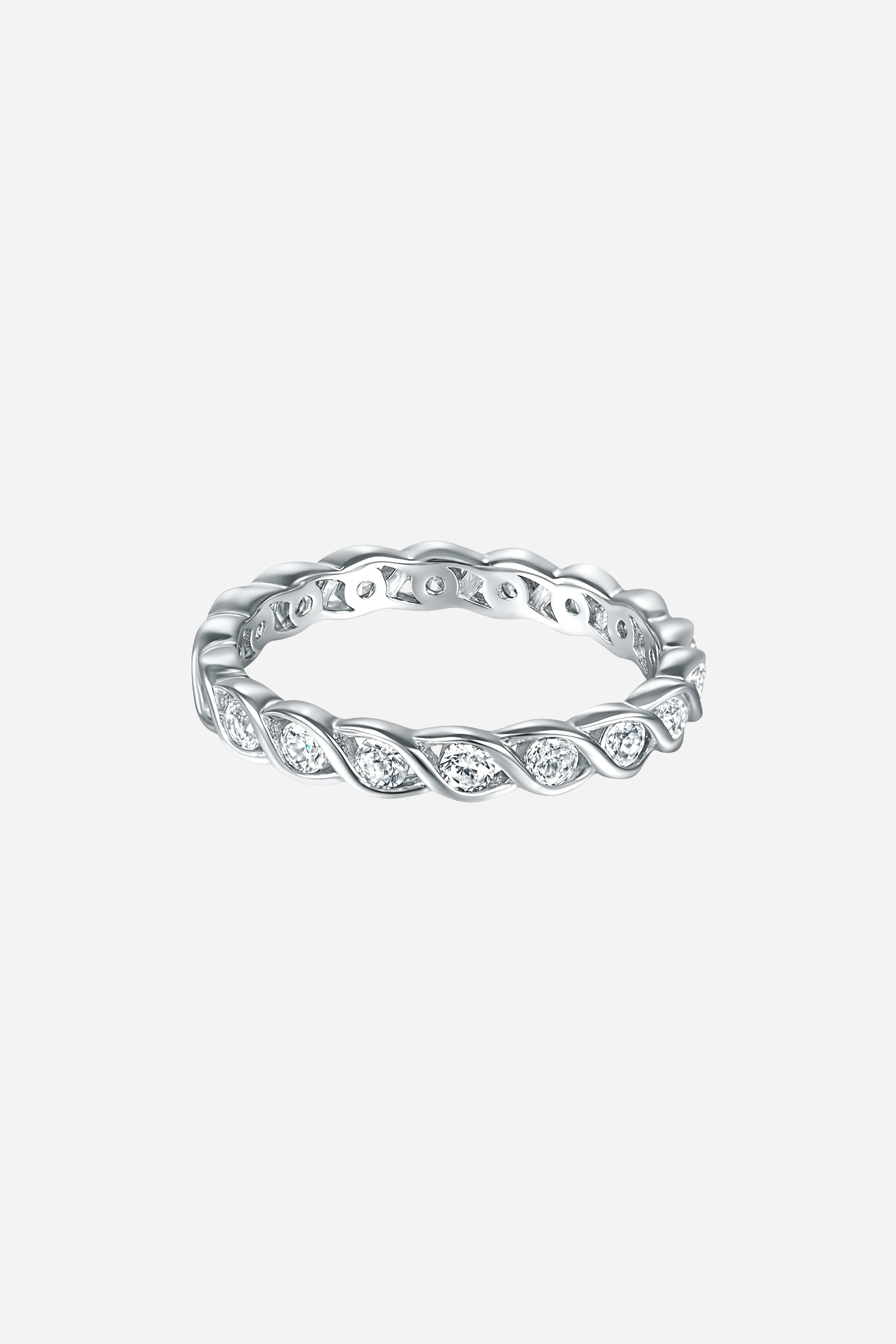 Top-view of GLISTIA sterling silver twist eternity ring featuring a braided band design and bezel-set zircon stones.