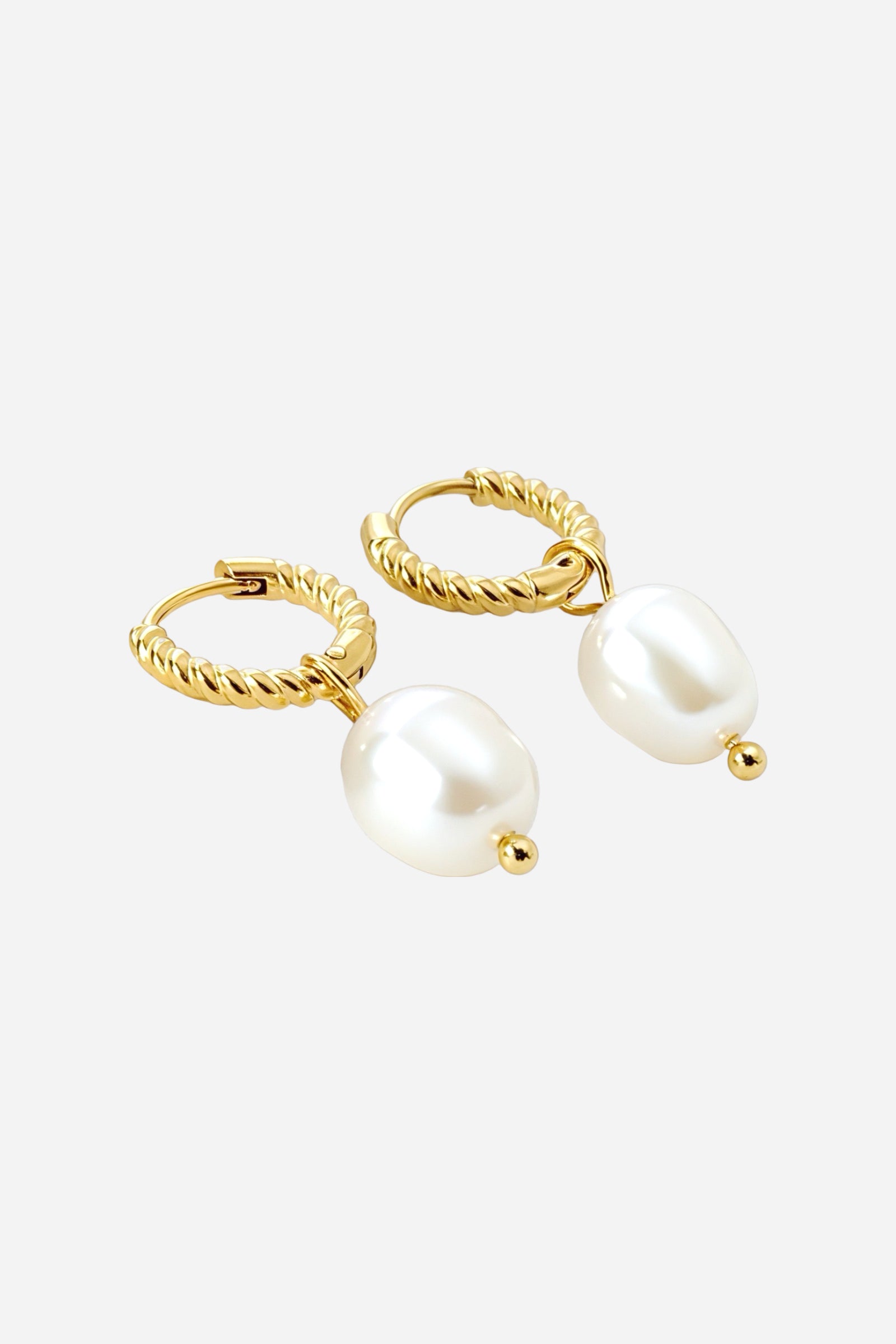 Side view of twisted hoop pearl drop earrings crafted from stainless steel with a lustrous PVD 18K gold plated finish, featuring a single white pearl accent for an elegant timeless appeal – GLISTIA.