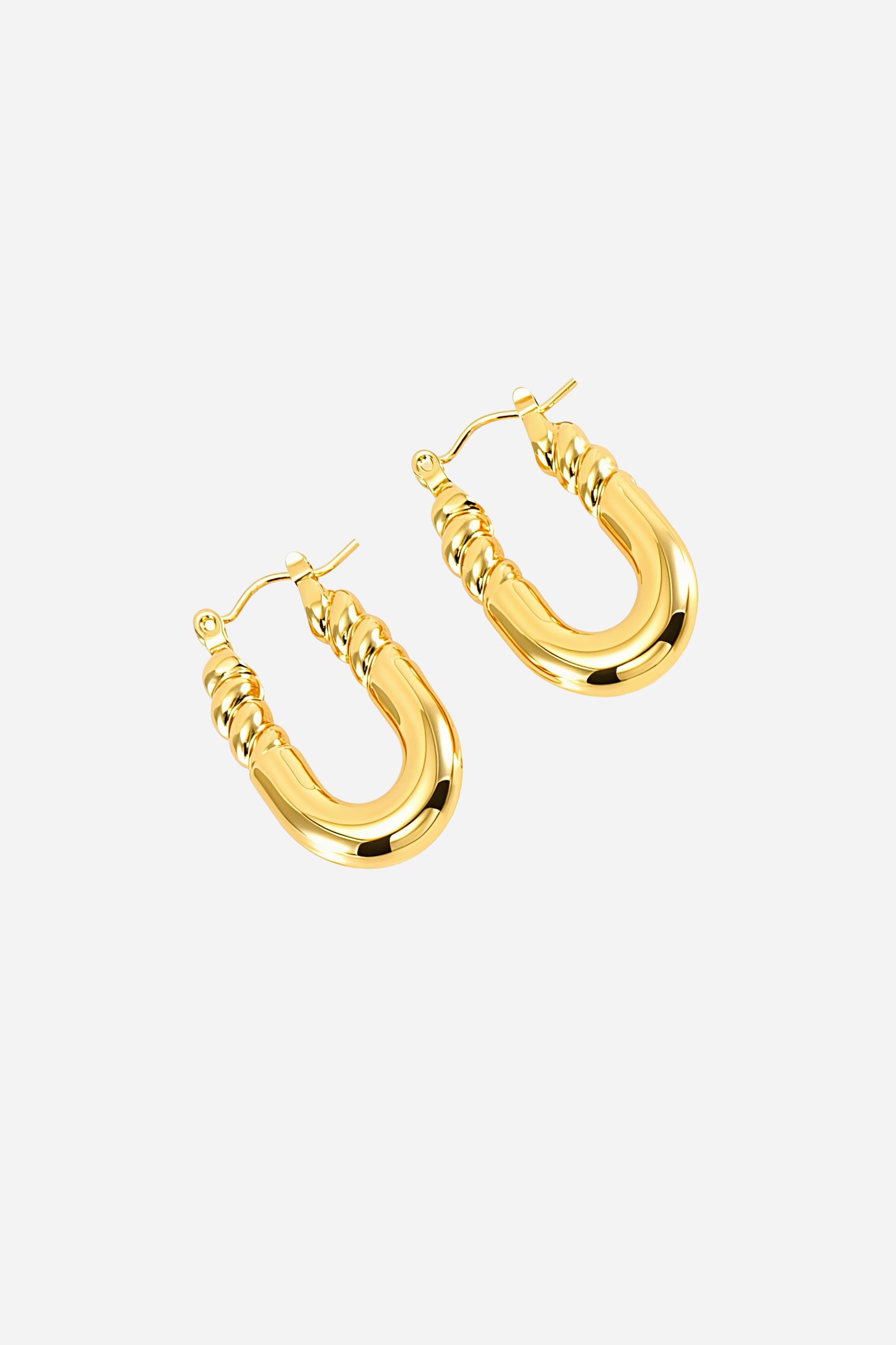 Top view of U-shaped twisted hoop earrings made from stainless steel with a high-shine PVD 18K gold plated finish, highlighting the sculpted curves and twisted detailing near the clasp – GLISTIA.