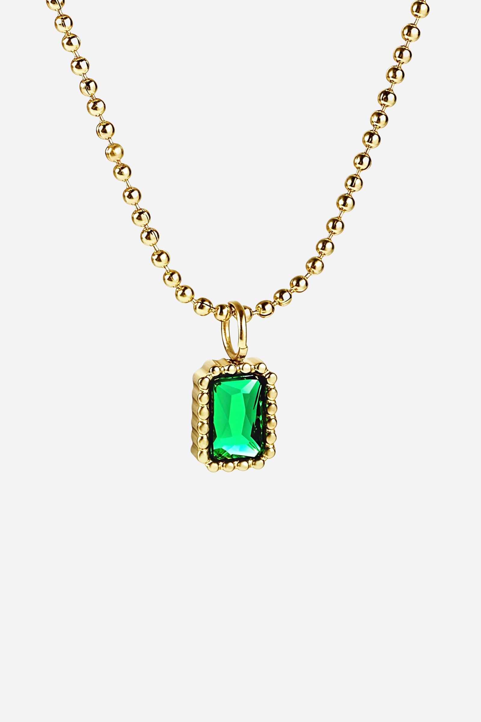 Top-view image of GLISTIA Verdantia Gem Necklace showcasing the 18K PVD gold plated ball chain and green gemstone pendant.