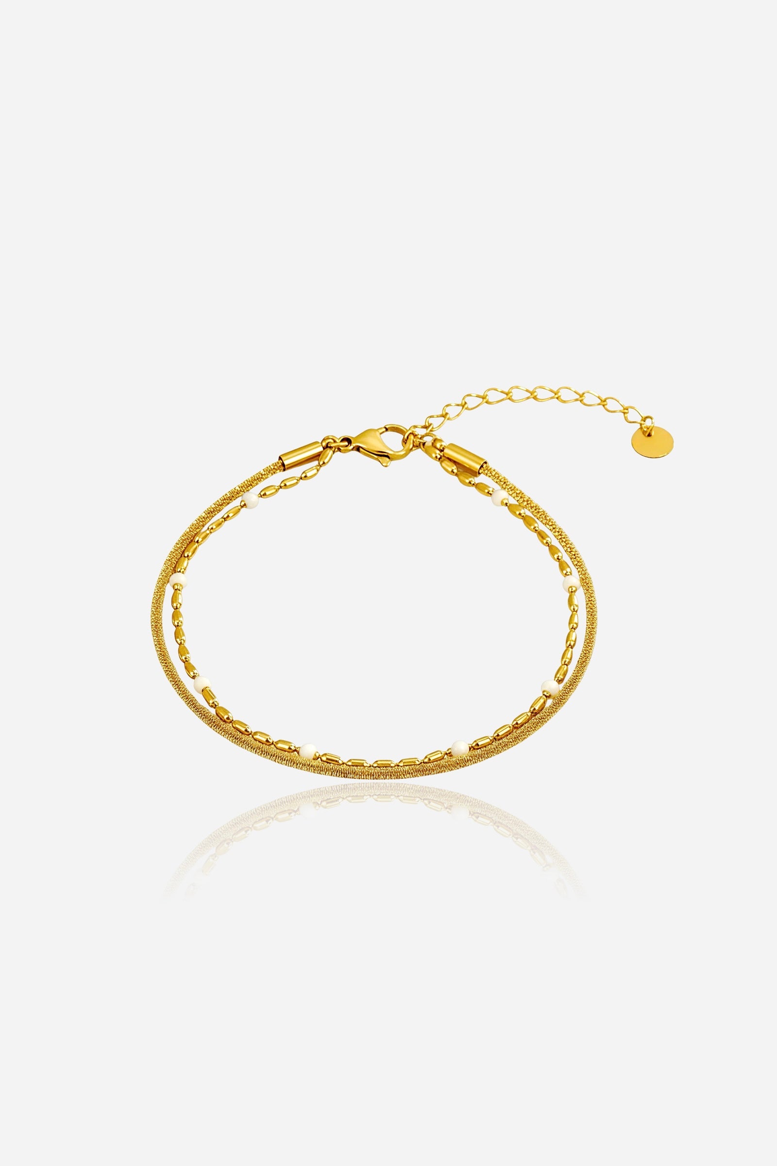 White beaded dual chain bracelet in PVD 18K gold-plated stainless steel, front view – Glistia