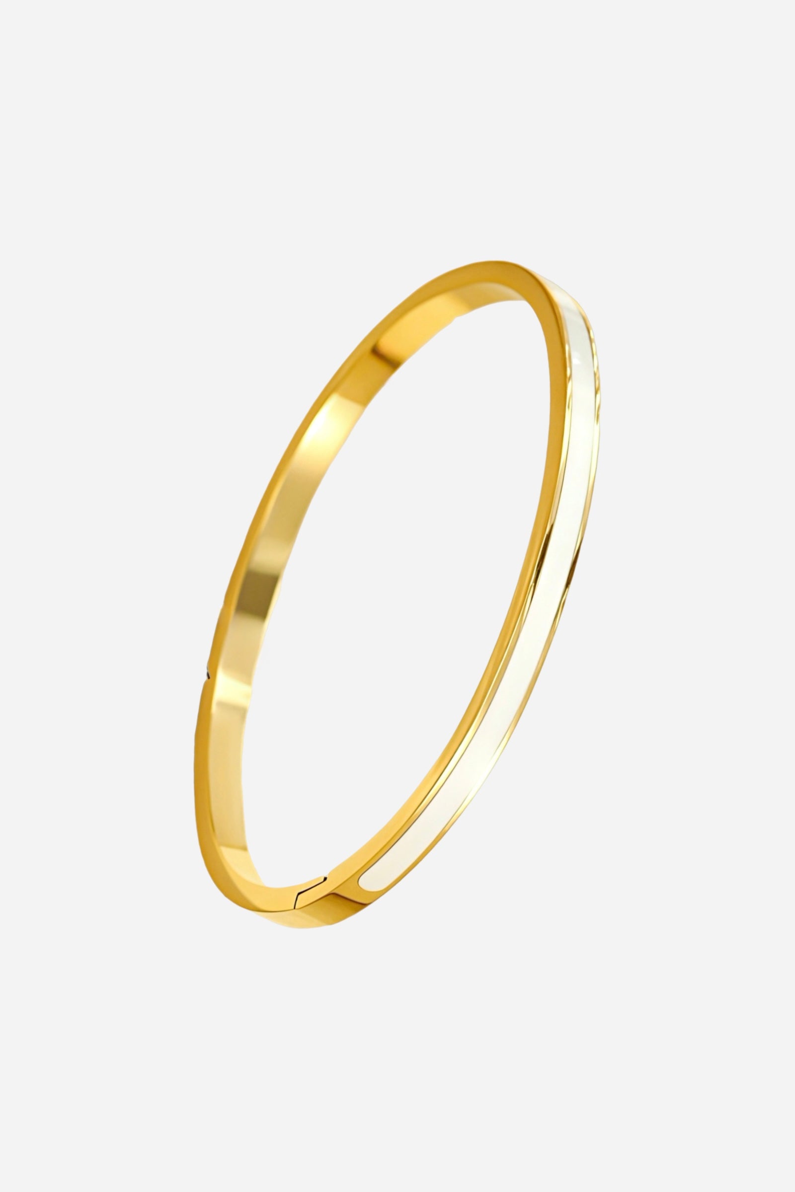 Side profile of slim white enamel bangle featuring smooth gold edges and minimalist design – GLISTIA
