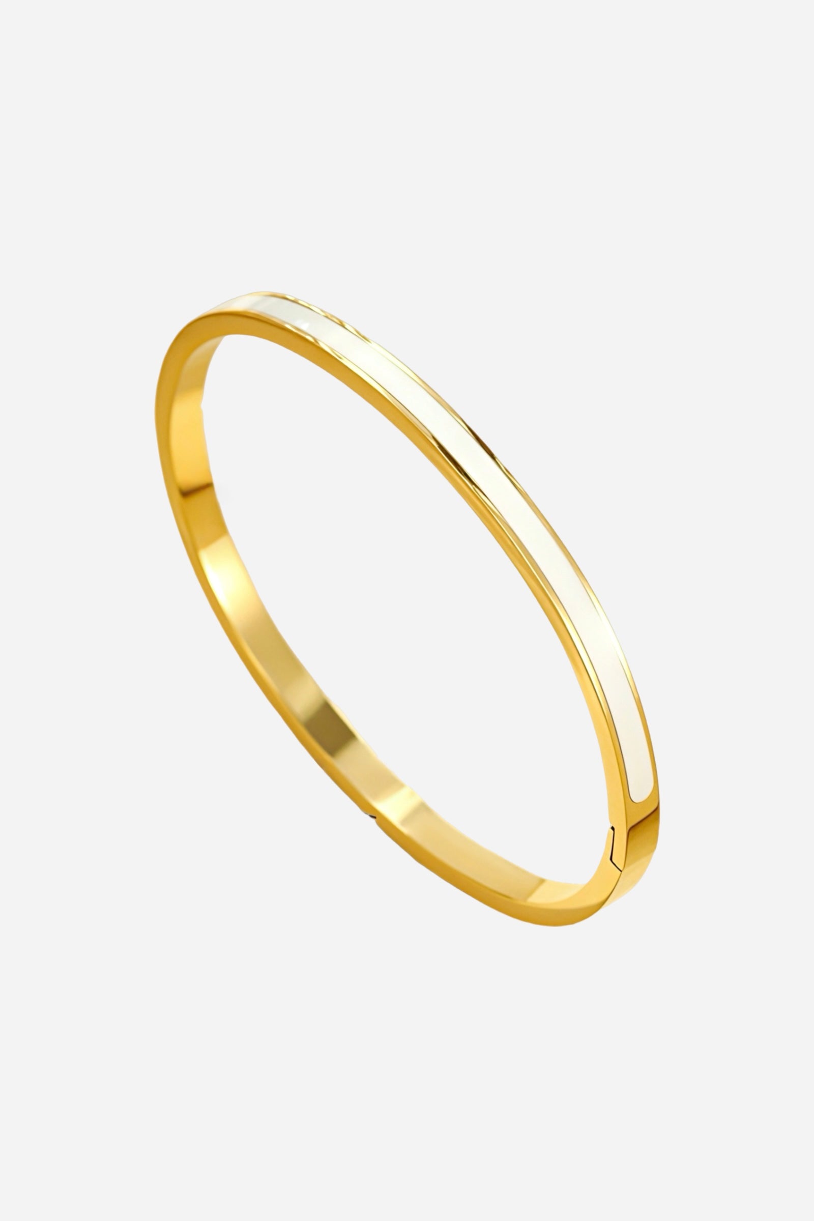 Top-down view of GLISTIA white enamel slim bangle showcasing polished 18K gold finish and clean white inlay strip.