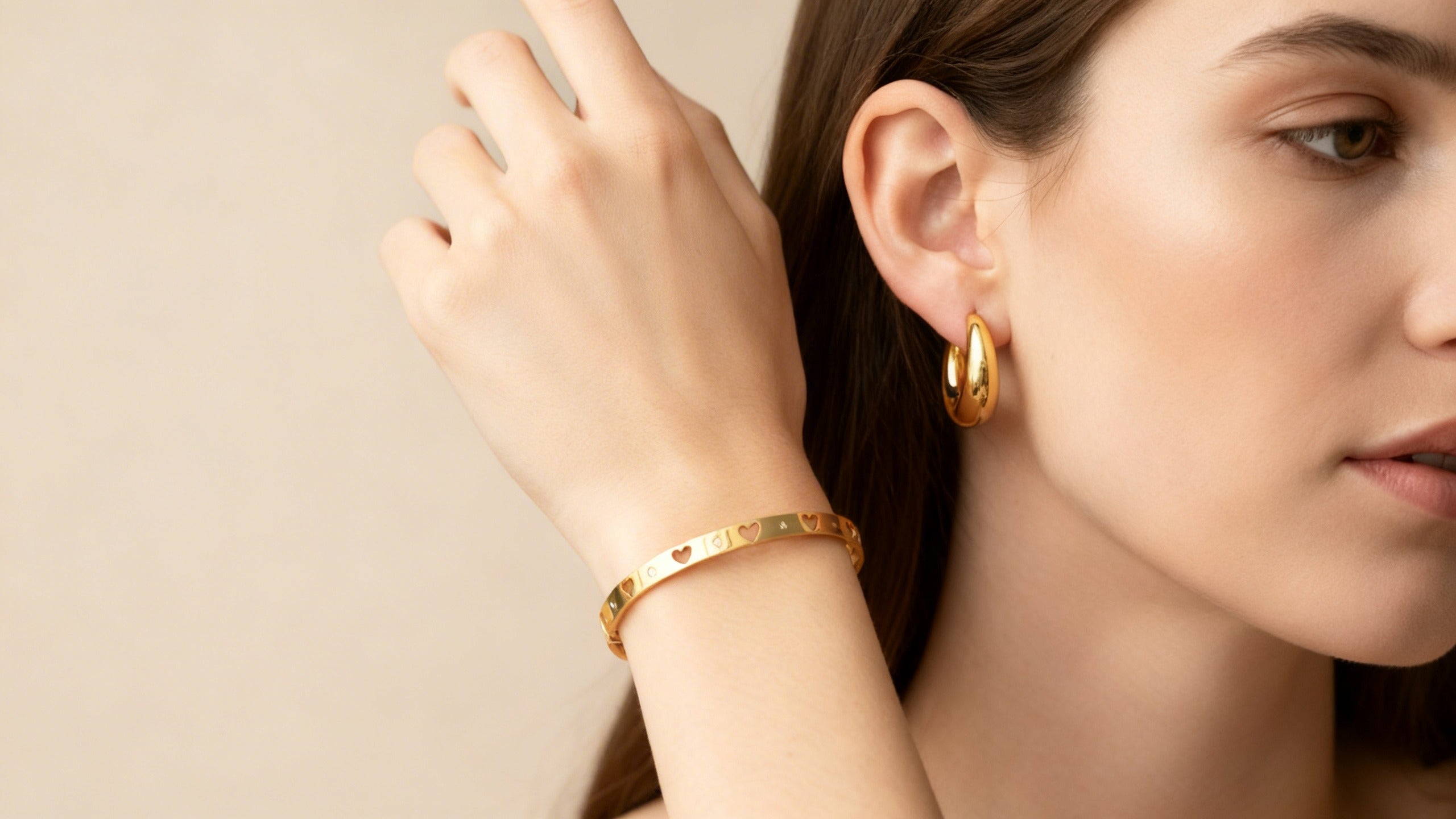 Everyday jewellery styling featuring gold plated earrings and bangles for modern wear.