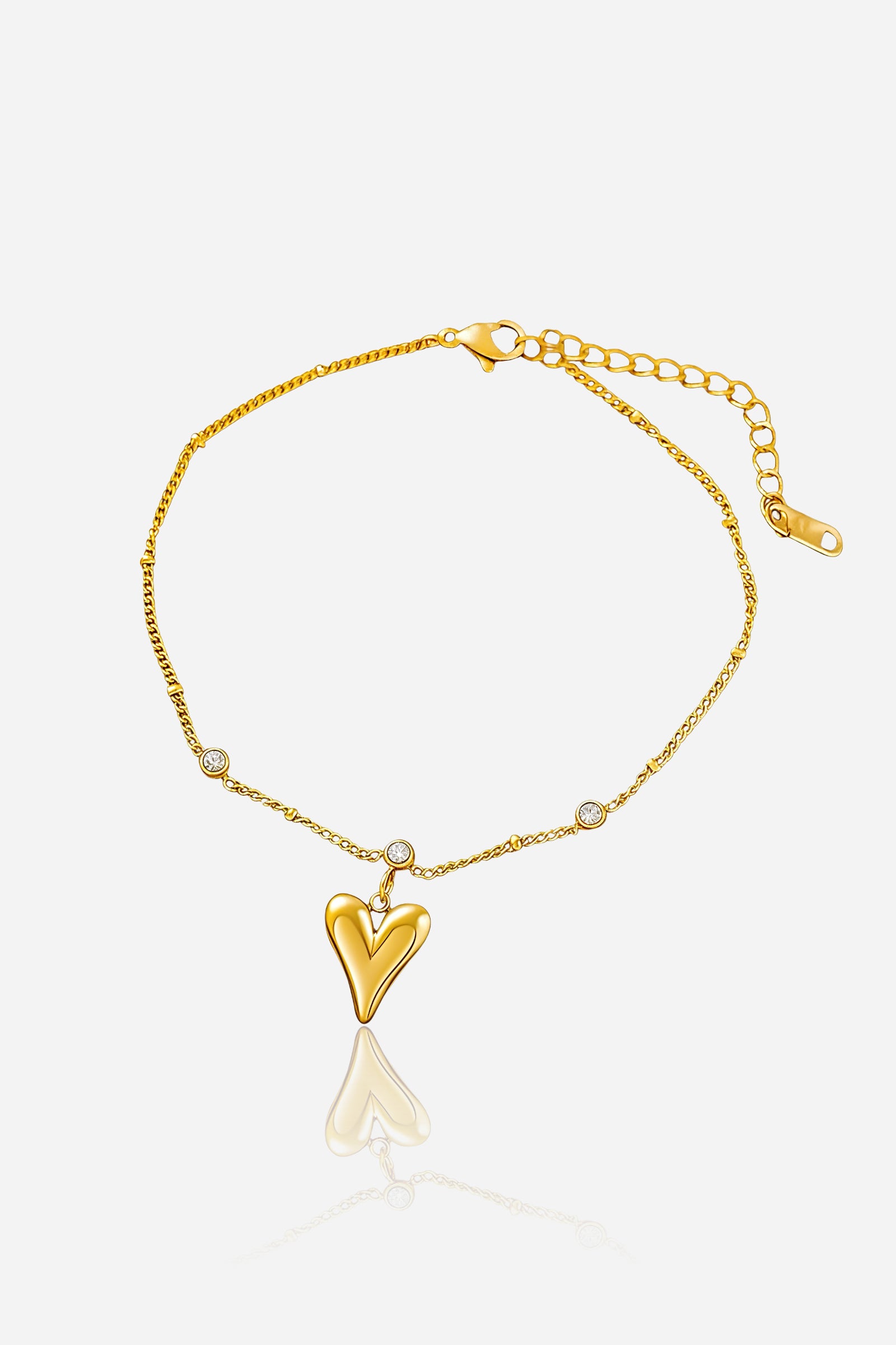 Front view of the Amoura Heart Charm Anklet in PVD 18K gold plated stainless steel with cubic zirconia accents – GLISTIA.