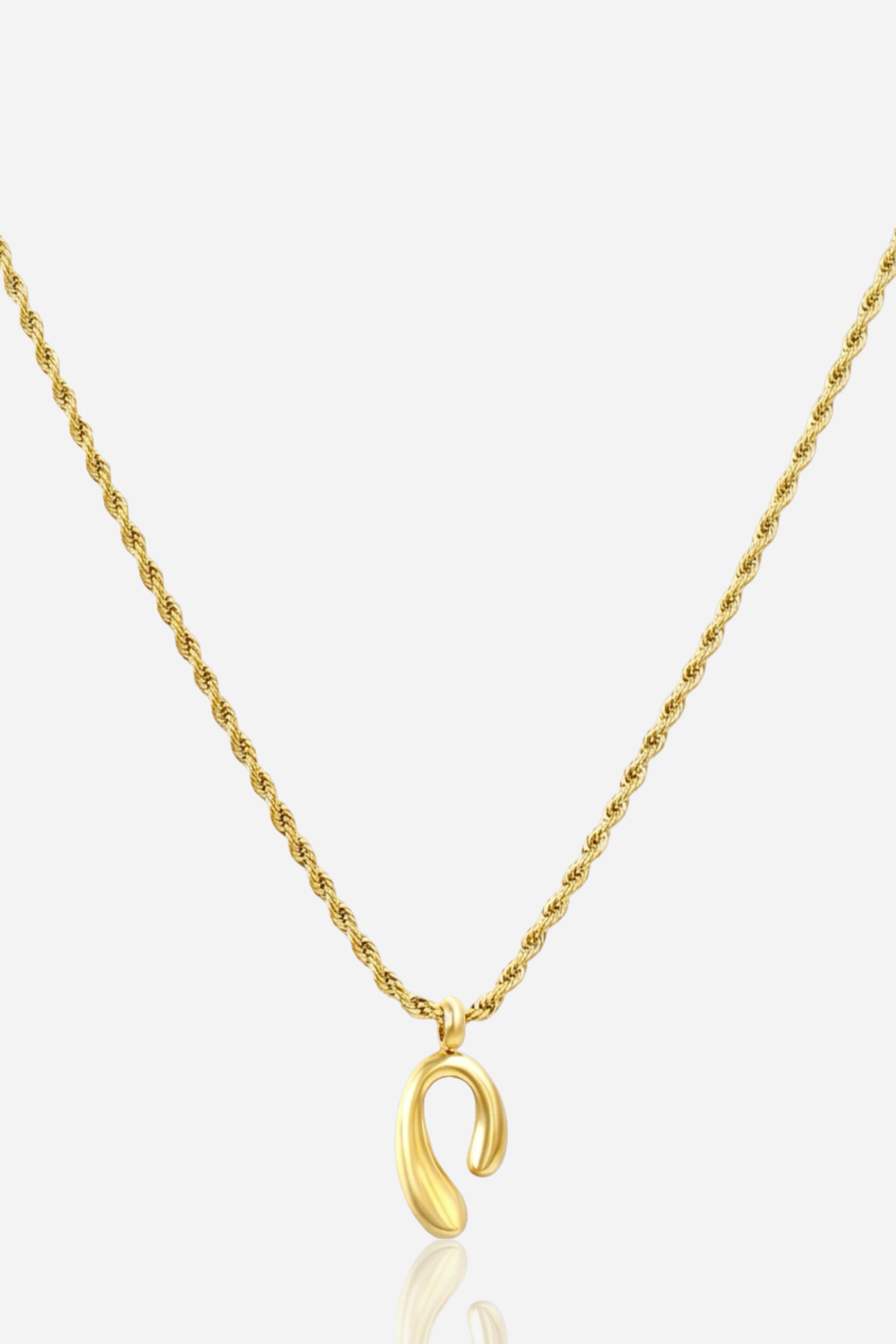 Zoom angle of GLISTIA Auric Curve Pendant Necklace featuring a fluid gold abstract charm on a twisted rope chain.
