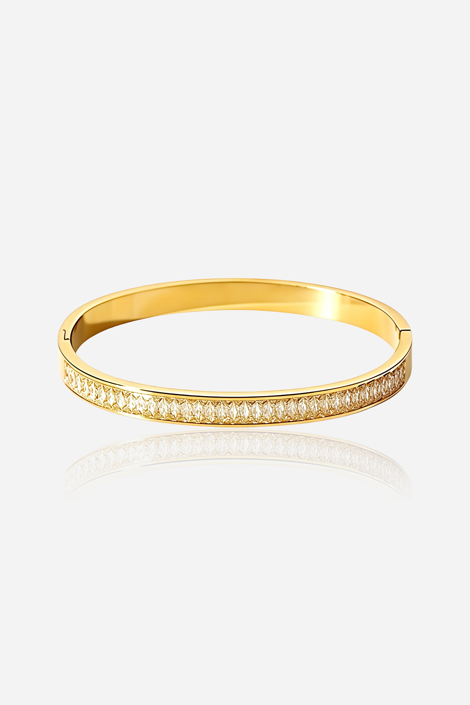 Front view of GLISTIA Baguette Crystal Line Bangle made from stainless steel with a PVD 18K gold plated finish, showcasing a continuous row of baguette-cut crystals in a channel setting.