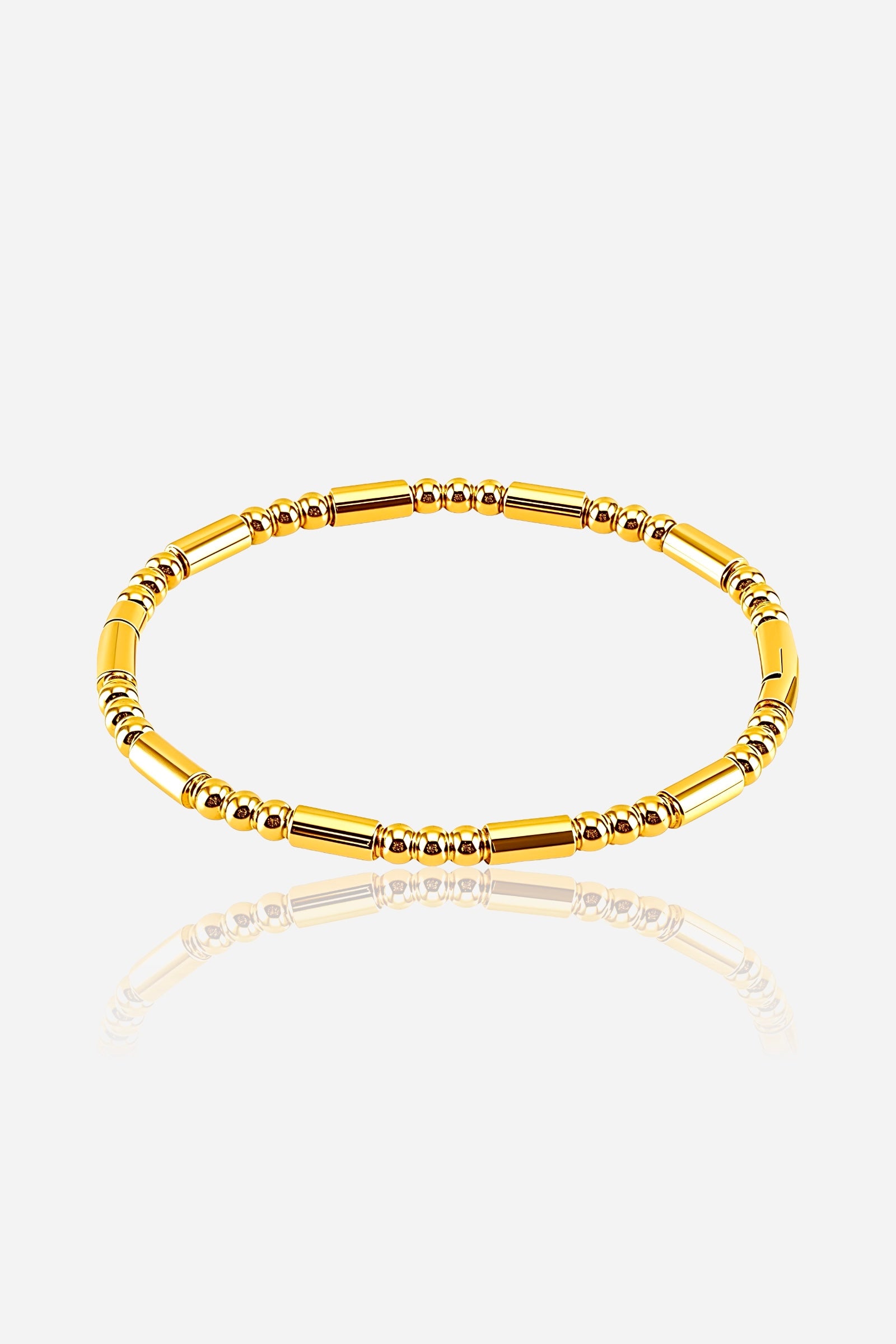Front view of the Beaded Tube Bangle crafted from stainless steel with a PVD 18K gold plated finish, showcasing alternating tube and round bead design - GLISTIA.