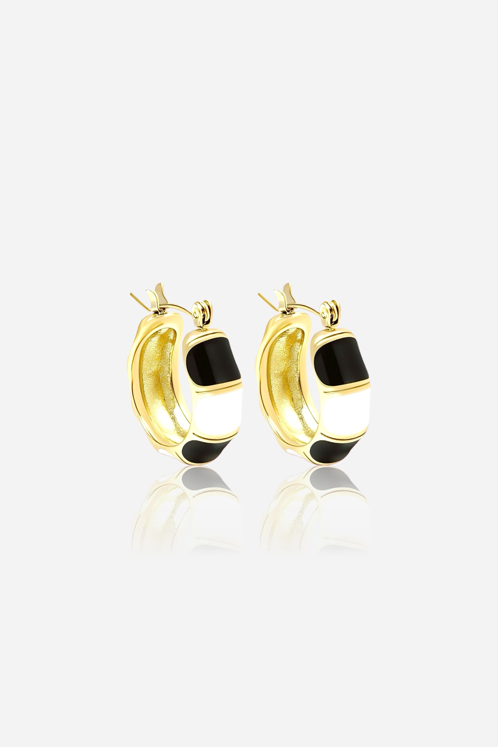 Front view of black and white enamel hoop earrings crafted in 18K gold plated stainless steel with glossy enamel detailing and polished gold finish – GLISTIA jewellery