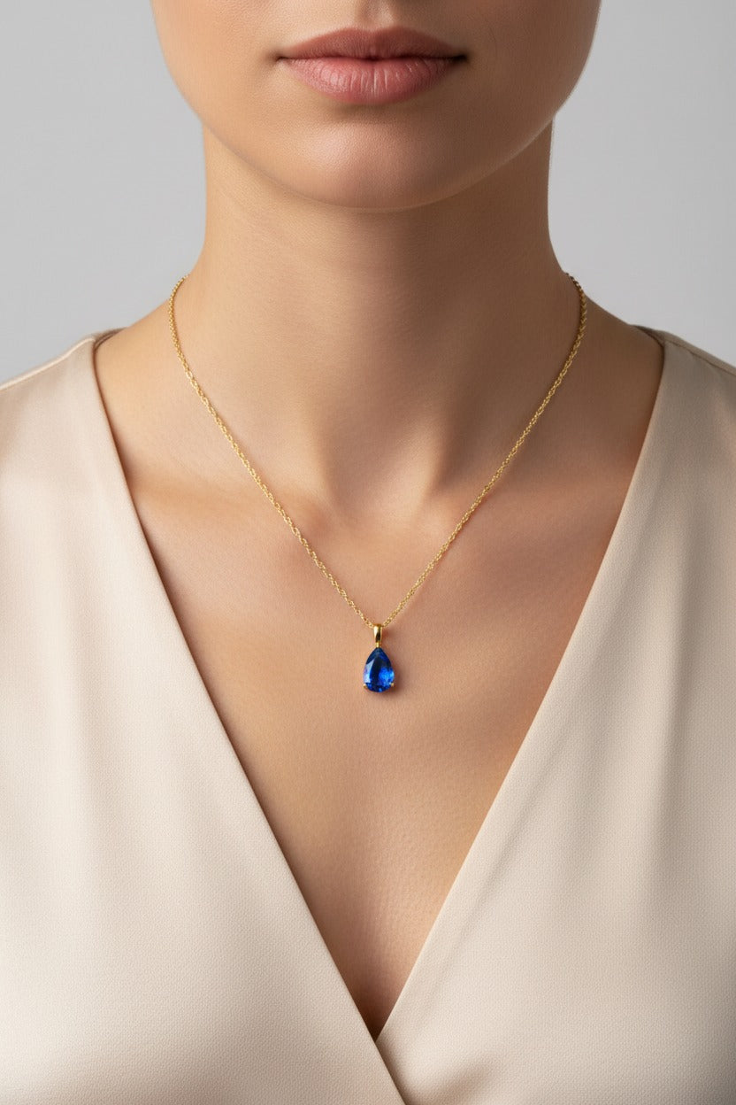 Blue zircon birthstone necklace for December with blue teardrop pendant in 18K PVD gold plated stainless steel