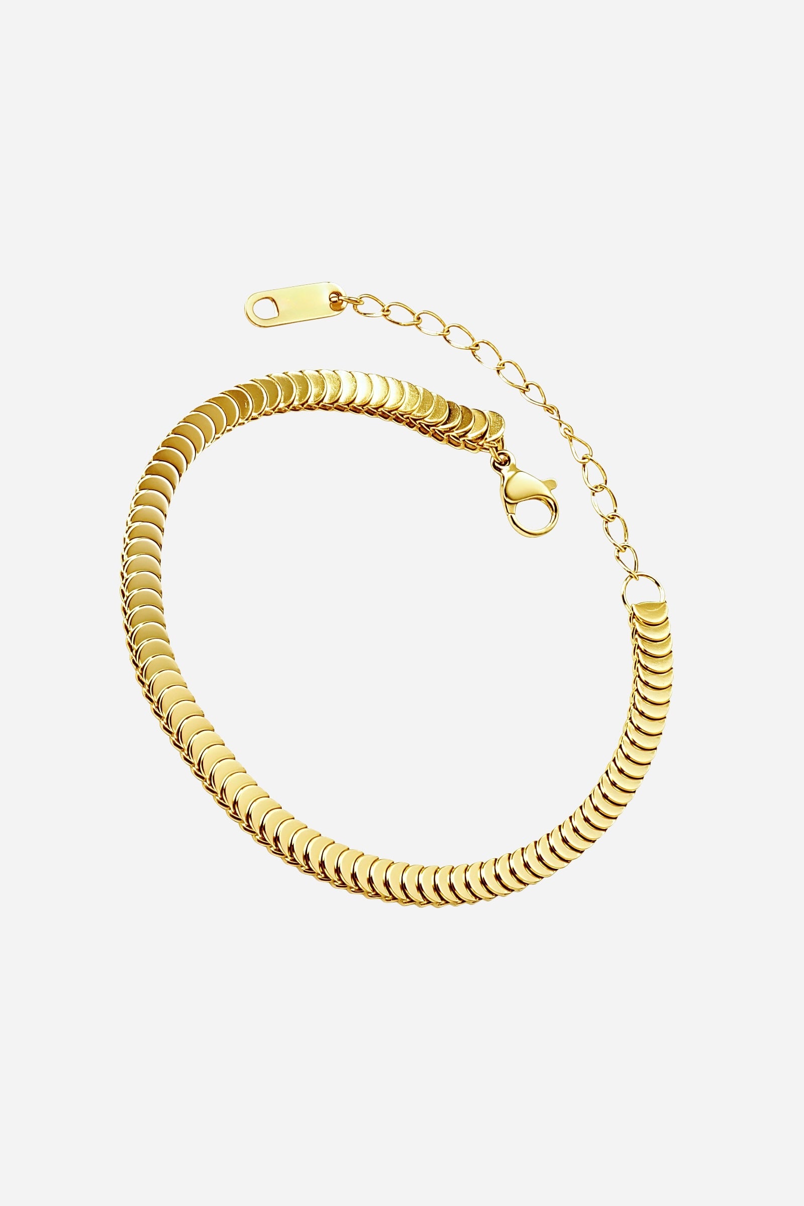 Top-view of GLISTIA’s Celeste bracelet featuring sleek, overlapping gold disc links along a fine adjustable chain.