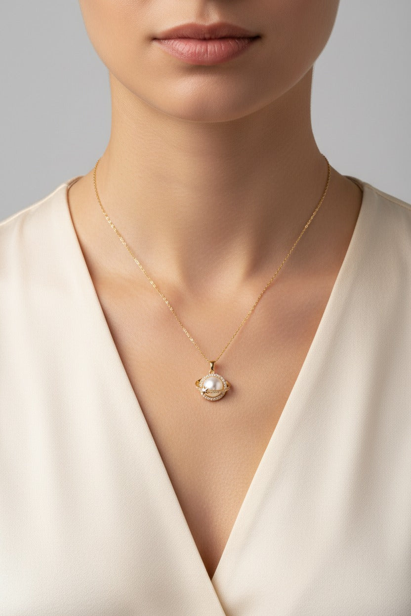 Celestial Orbit Pendant Necklace crafted in 18K PVD gold plated stainless steel with mother of pearl centre, zircon crystal halo and star detail