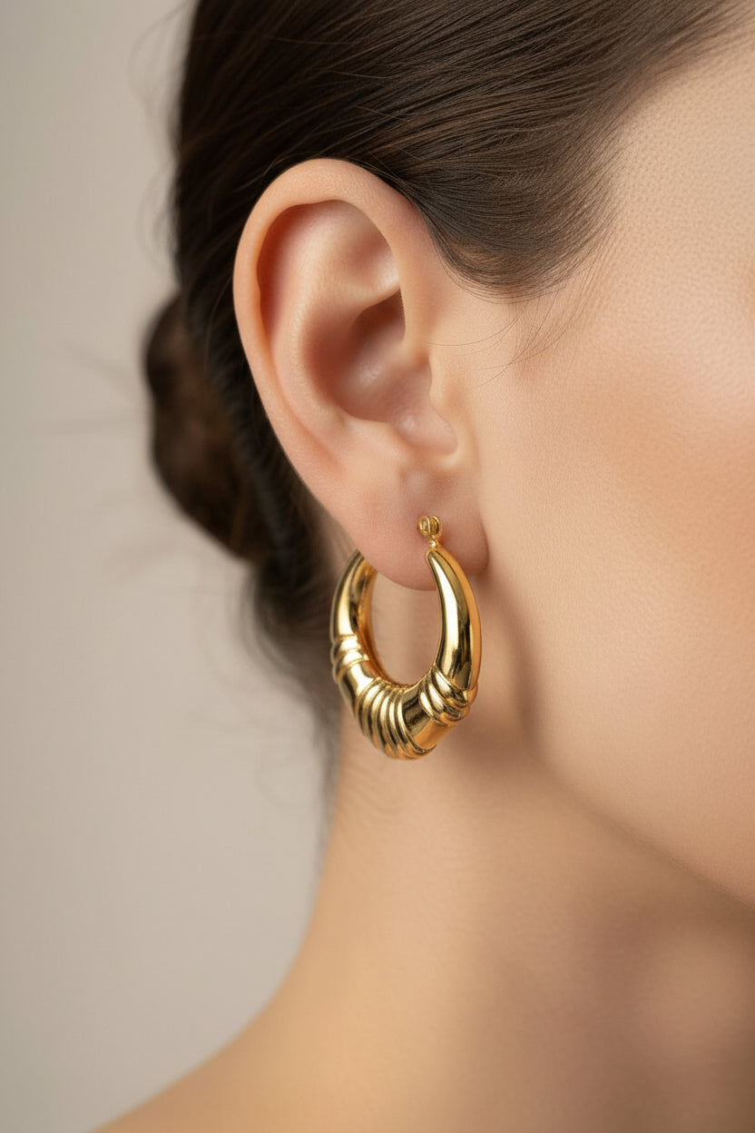 front view of chunky ridged hoop earrings in 18K PVD gold plated stainless steel with bold rounded design