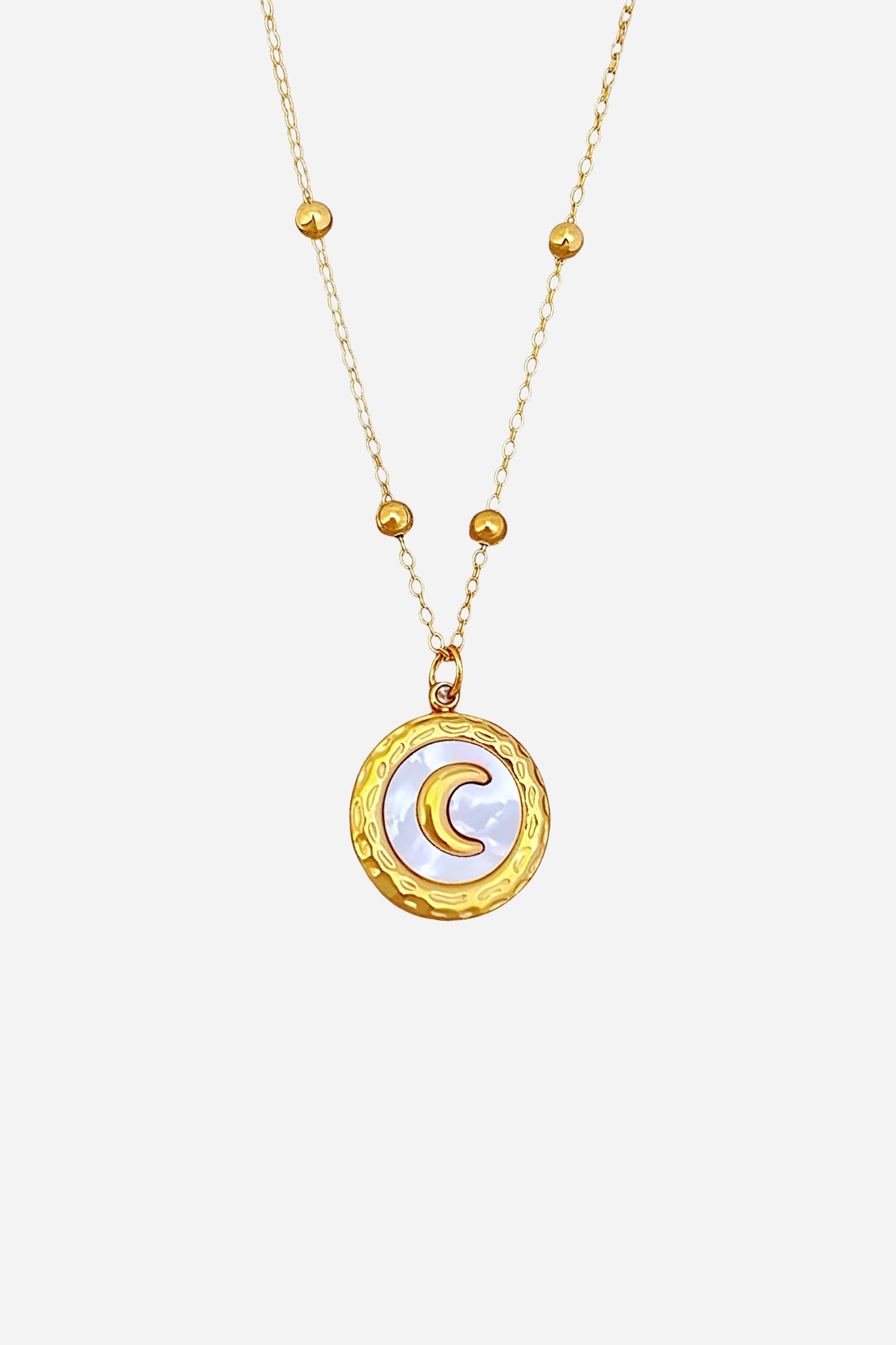 Top view of Crescent Moon Pendant Necklace with engraved moon medallion and gold plated stainless-steel chain – GLISTIA.