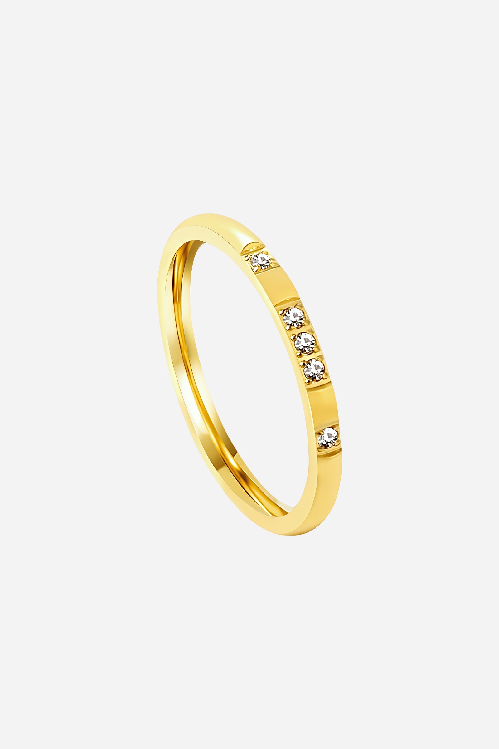 Close-up of GLISTIA PVD 18K gold plated slim ring highlighting the precision-set clear crystals and smooth finish.