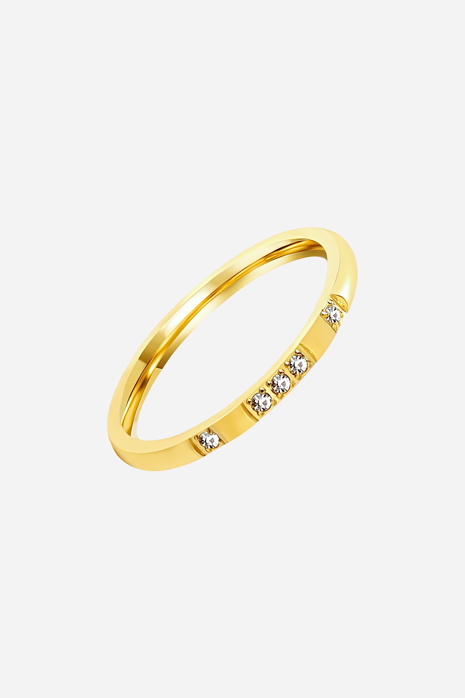 Side-angle image of GLISTIA Crystal Accent Slim Band Ring showcasing the polished gold band and inset stones.