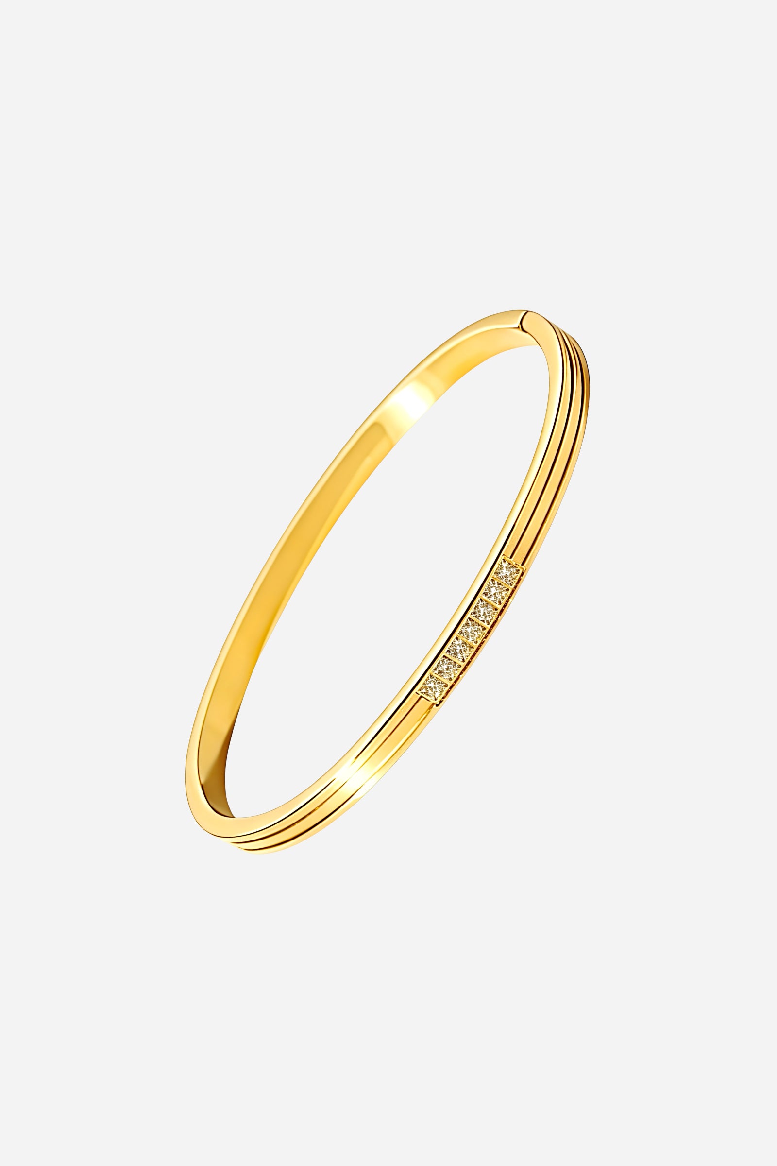 Top view of the slim gold PVD stainless steel bangle with a centred cubic zirconia crystal bar accent – GLISTIA.