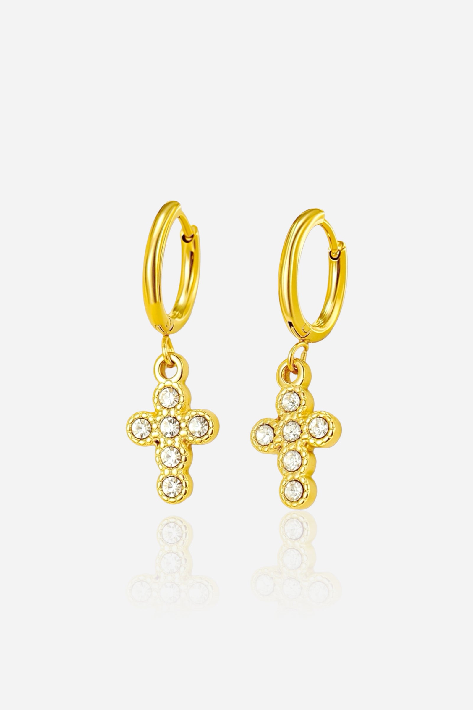 Crystal cross charm hoop earrings crafted from stainless steel with a radiant PVD 18K gold plated finish, featuring small hoops with sparkling crystal cross pendants - GLISTIA.