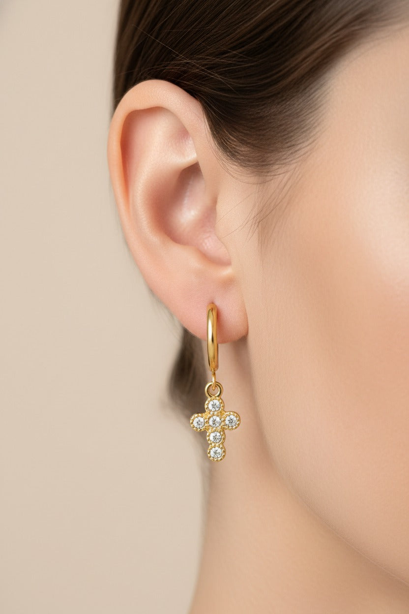 Side view of crystal cross charm hoop earrings in 18K PVD gold plated stainless steel, lightweight and water safe for everyday wear
