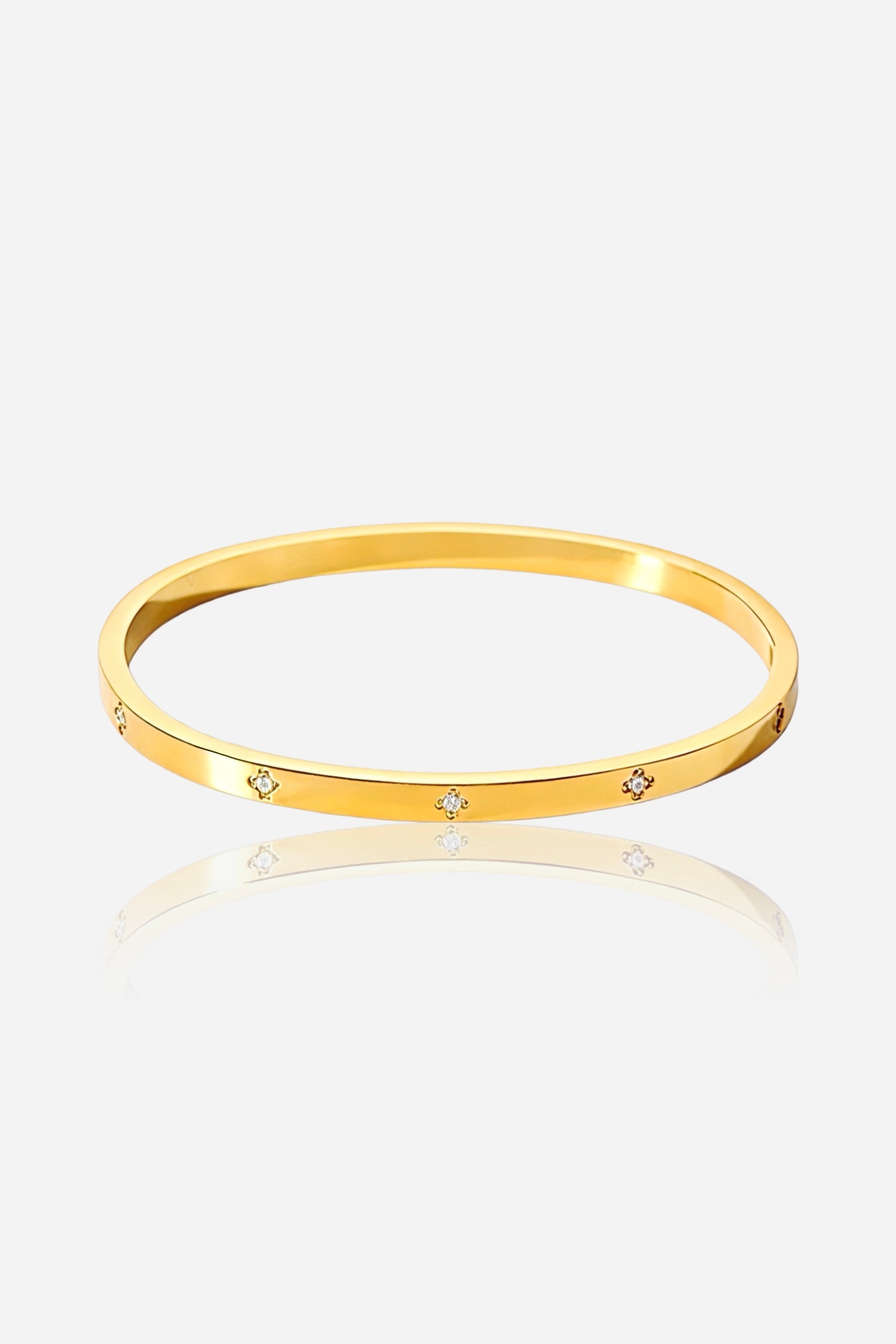 Front view of the Diamond Accent Slim Bangle in PVD 18K gold plated stainless steel with spaced cubic zirconia details – GLISTIA