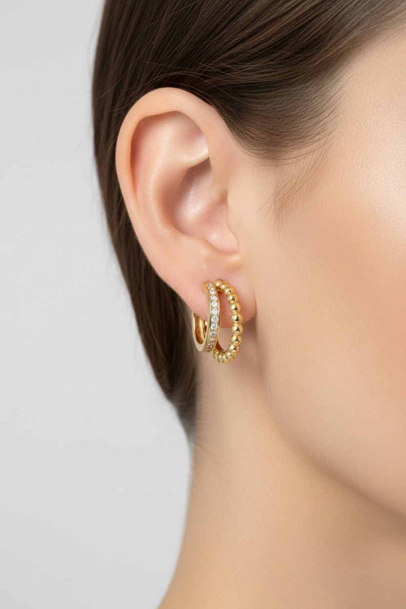 Double row beaded crystal hoop earrings worn on ear, crafted from stainless steel with 18K PVD gold plating and sparkling crystal accents

