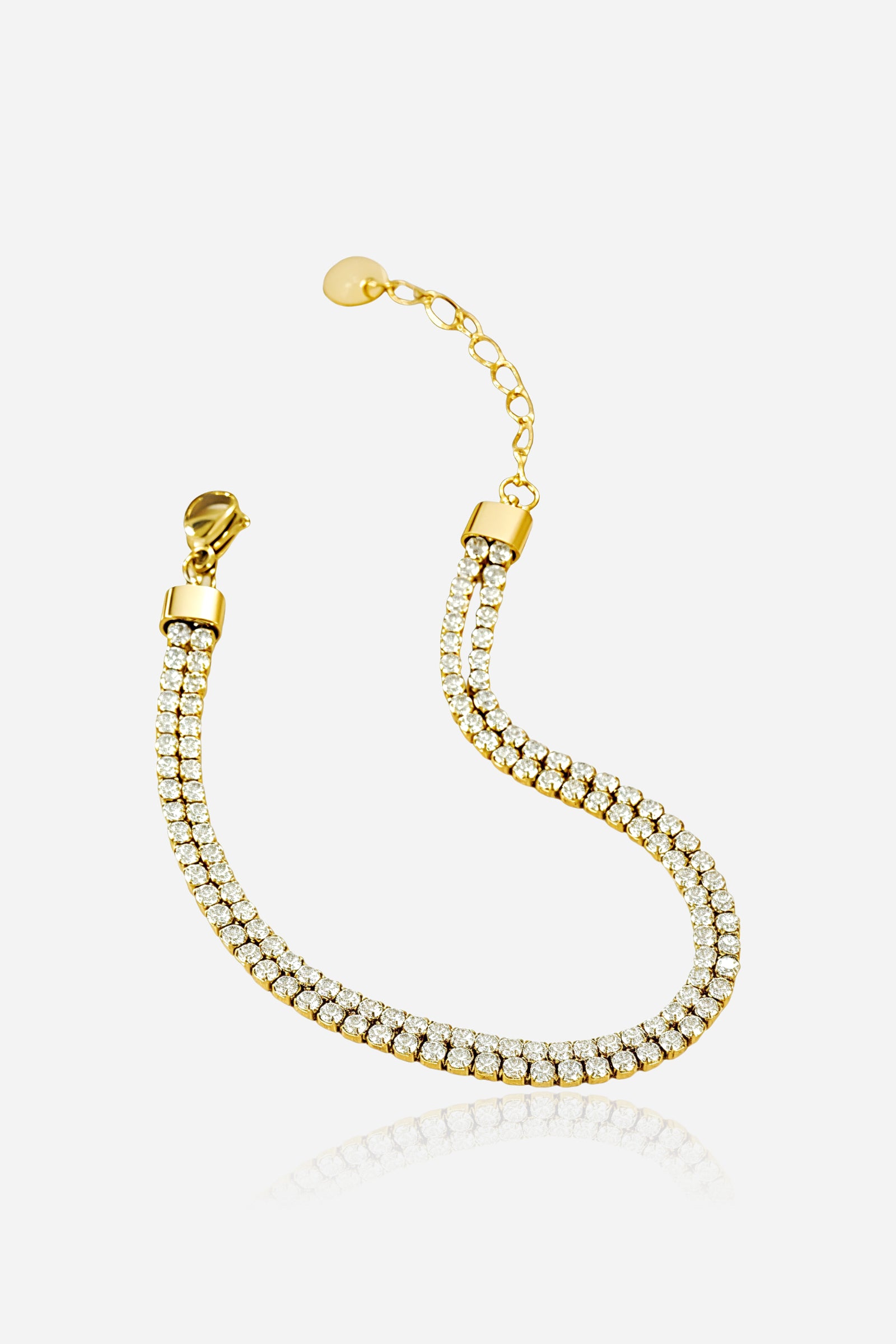 GLISTIA double row gold tennis bracelet in PVD 18K gold plated stainless steel shown from the front with sparkling cubic zirconia stones.
