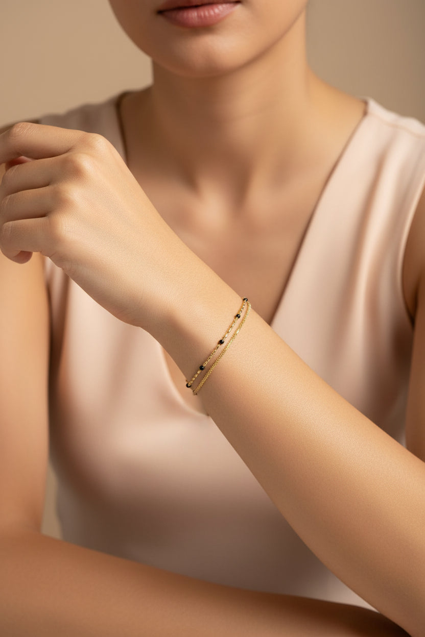 Dual Layer Black Bead Chain bracelet in 18K PVD gold plated stainless steel with elegant black bead detailing