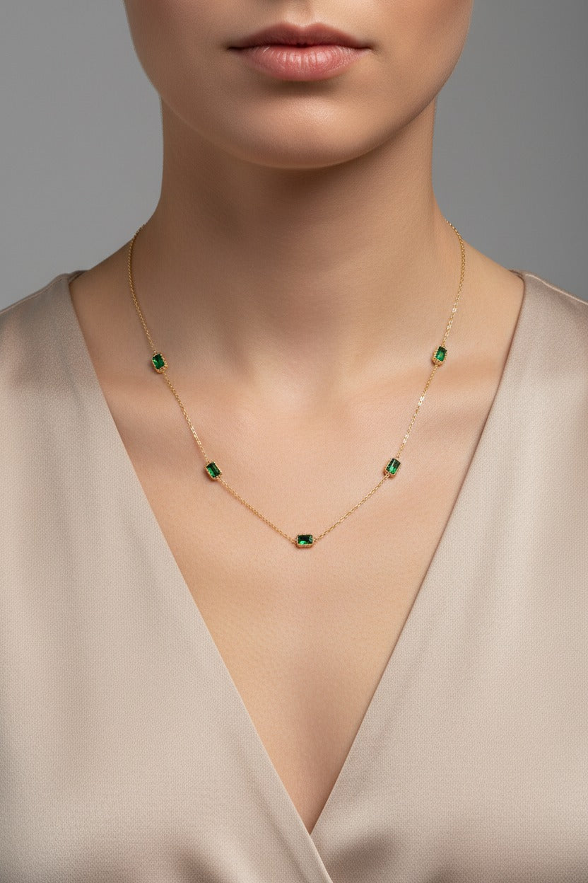 Emerald Accent Necklace crafted from stainless steel with 18K PVD gold plating, featuring a green emerald-toned zircon