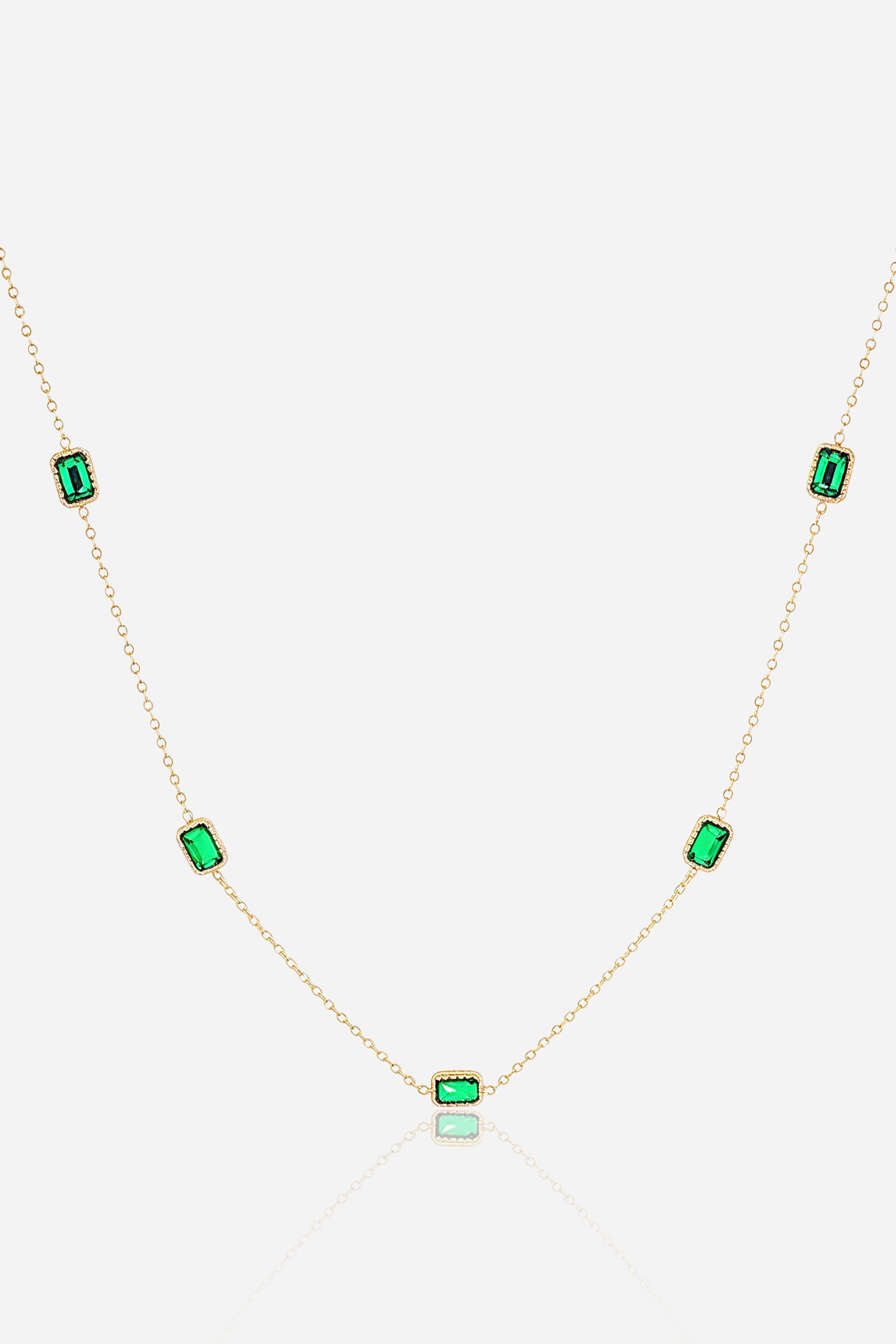 Zoom view of emerald accent stones set on a delicate gold-plated chain – GLISTIA